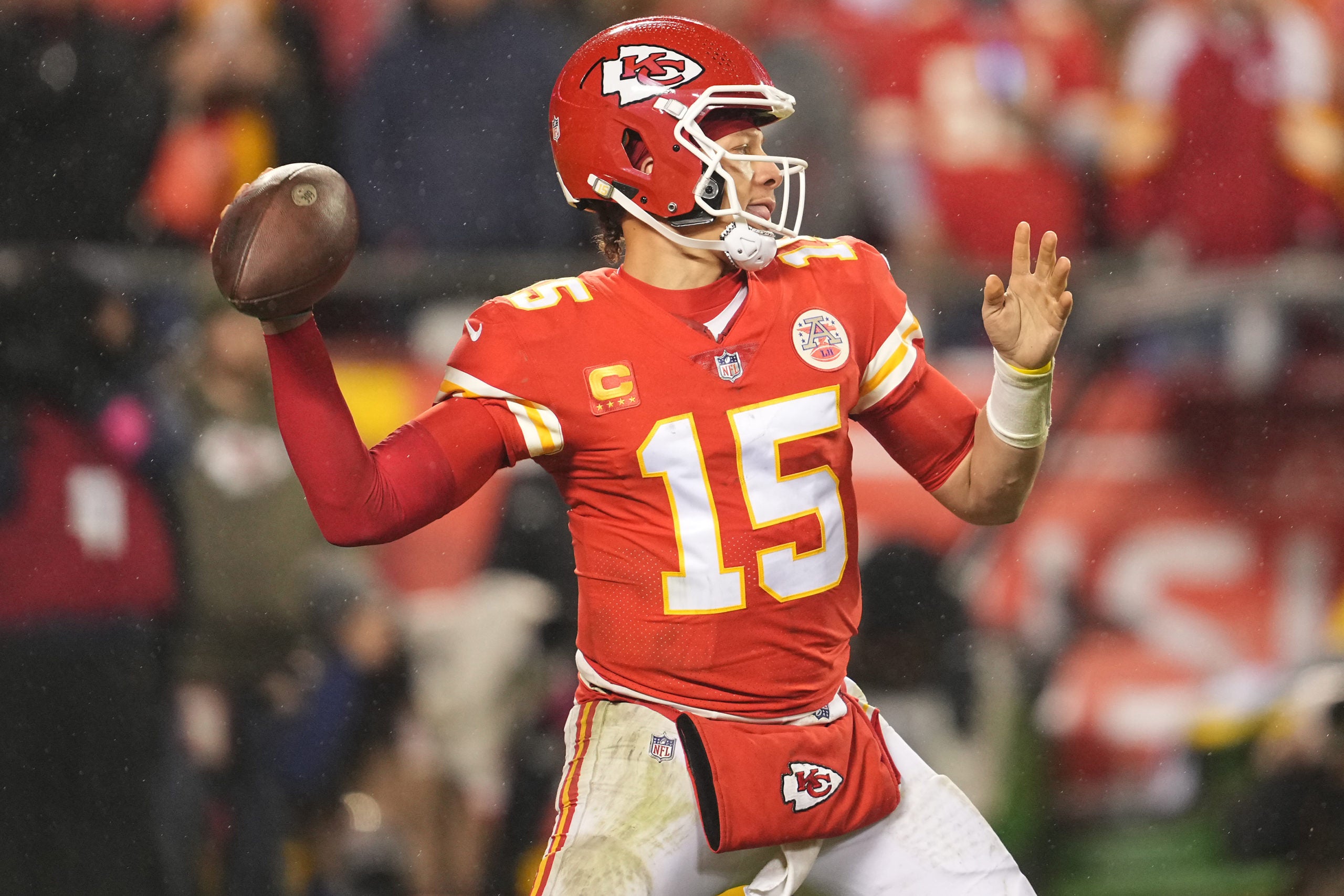 Jan 21, 2023; Kansas City, Missouri, USA; Kansas City Chiefs quarterback Patrick Mahomes (15) throws against the Jacksonville Jaguars during the second half in the AFC divisional round game at GEHA Field at Arrowhead Stadium. Mandatory Credit: Jay Biggerstaff-USA TODAY Sports