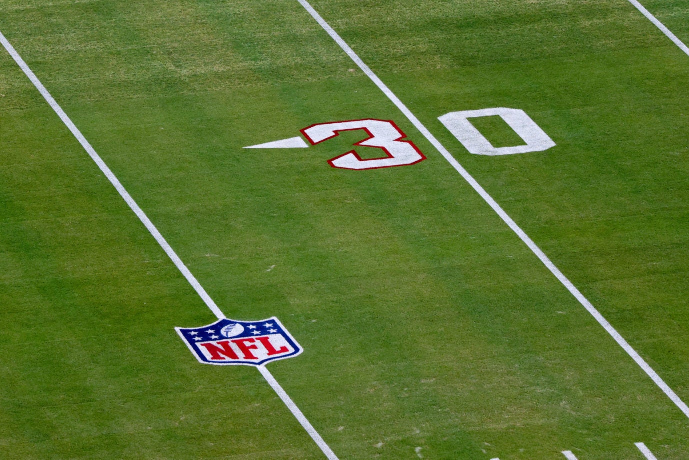 Jan 7, 2023; Jacksonville, Florida, USA;  the Jacksonville Jaguars pay tribute to Buffalo Bills safety Damar Hamlin (3) by outlining the number three on the field red before a game against the Tennessee Titans at TIAA Bank Field. Mandatory Credit: Nathan Ray Seebeck-USA TODAY Sports