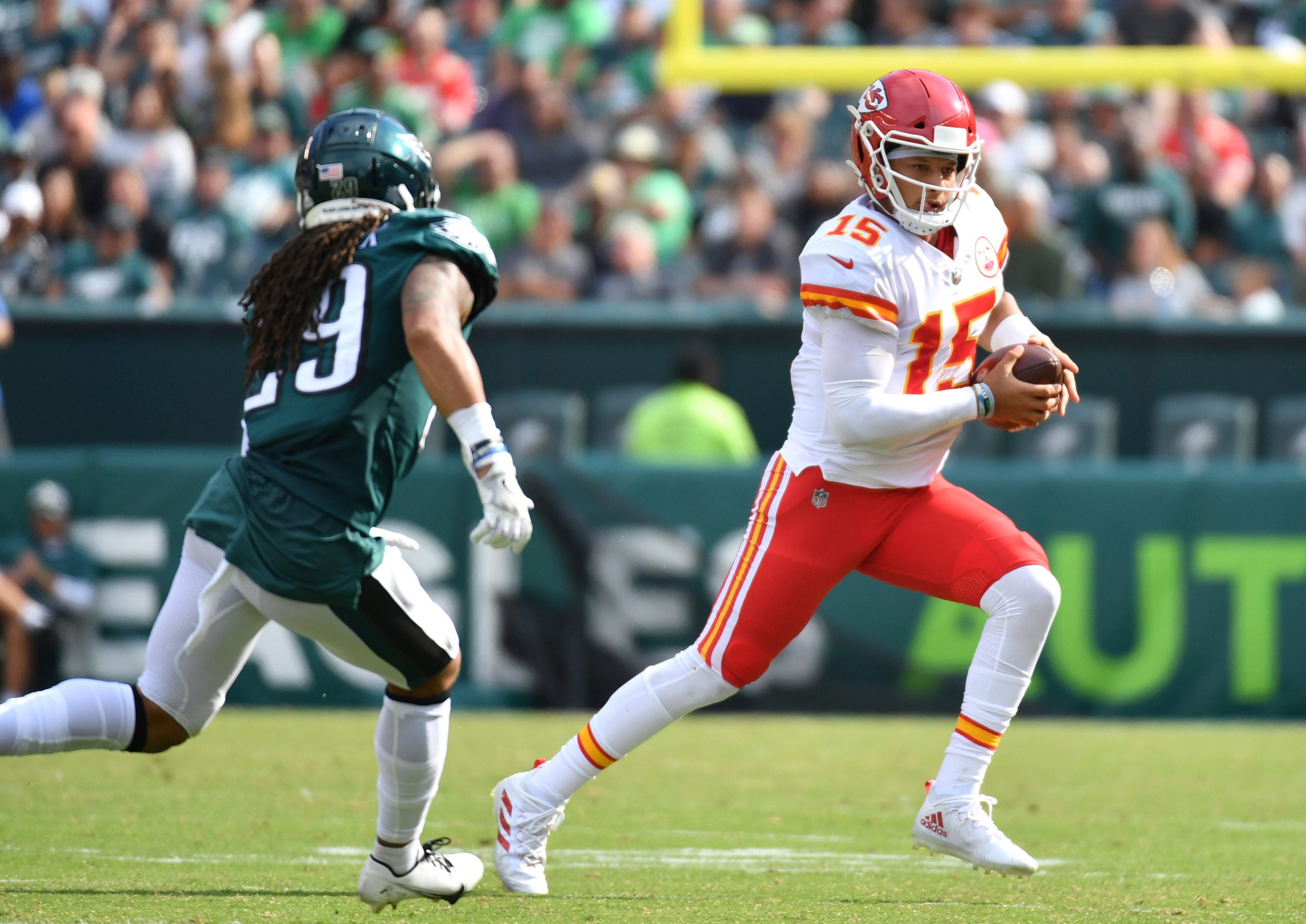 Oct 3, 2021; Philadelphia, Pennsylvania, USA; Kansas City Chiefs quarterback Patrick Mahomes (15) runs away from Philadelphia Eagles free safety Avonte Maddox (29) during the third quarter at Lincoln Financial Field. Mandatory Credit: Eric Hartline-USA TODAY Sports