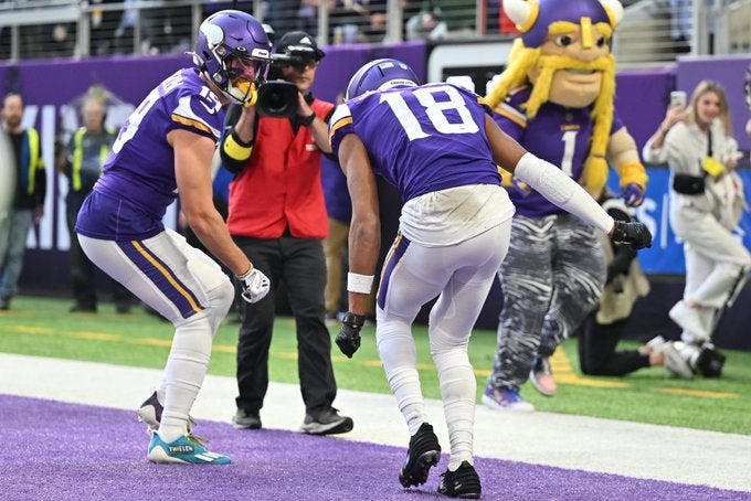 Minnesota Vikings Justin Jefferson Kirk Cousins Adam Thielen T.J. Hockenson K.J. Osborn offense passing receiving yards receptions catches Kirk Cousins WR NFL history record football stats news New York Giants playoffs