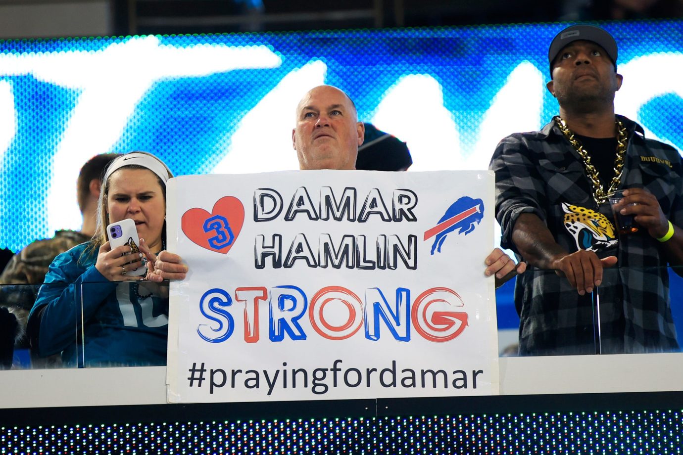 A fan holds up a sign in support of Buffalo Bills safety Damar Hamlin before the game of an NFL football regular season matchup AFC South division title game Saturday, Jan. 7, 2023 at TIAA Bank Field in Jacksonville. The Jacksonville Jaguars held off the Tennessee Titans 20-16. Hamlin suffered cardiac arrest on-field against the Cincinnati Bengals in week 17. [Corey Perrine/Florida Times-Union] Jki 230106 Titans Jags Cp 98