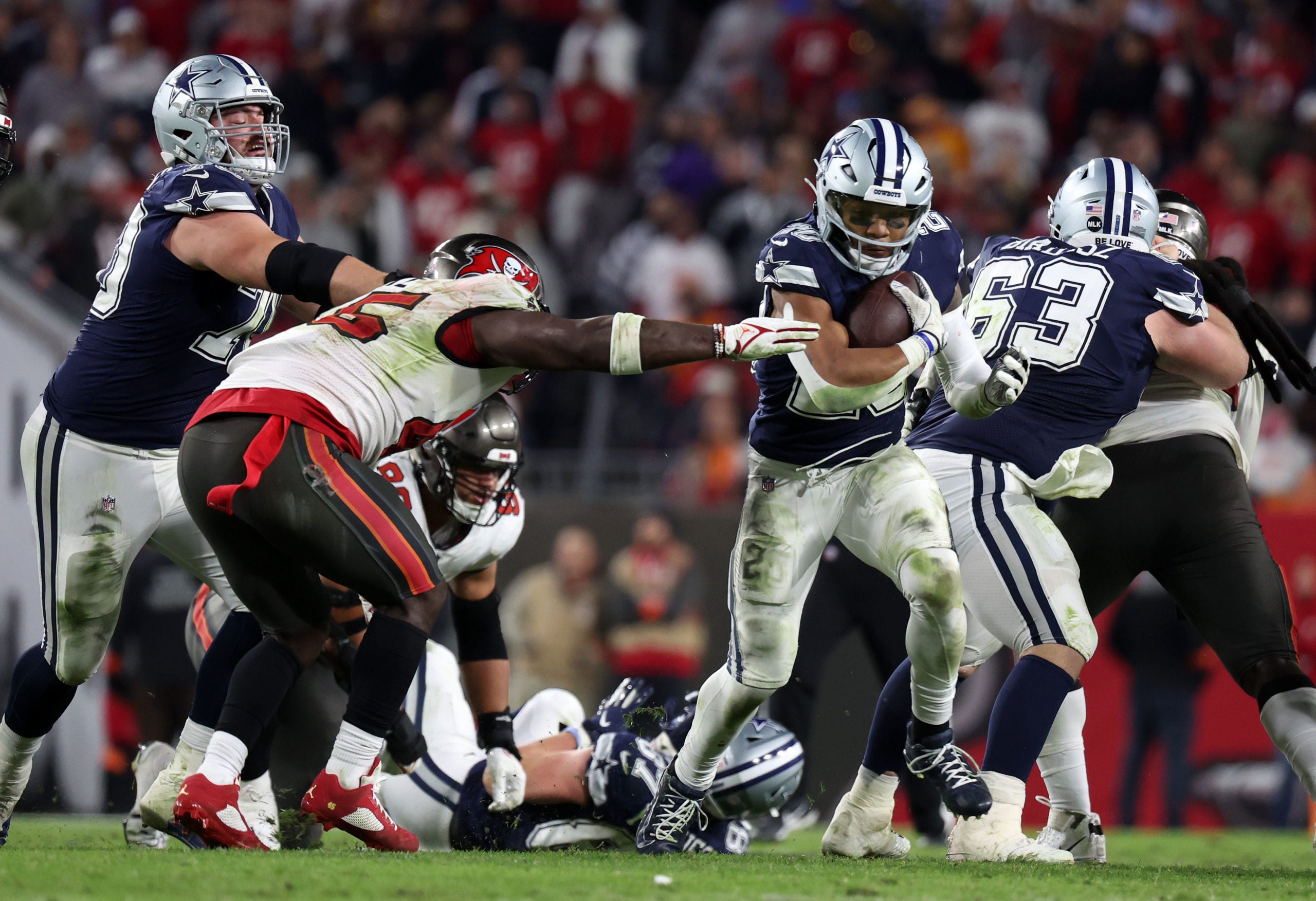 Jan 16, 2023; Tampa, Florida, USA; Dallas Cowboys running back Tony Pollard (20) rushes the ball against the Tampa Bay Buccaneers in the second half during the wild card game at Raymond James Stadium. Mandatory Credit: Kim Klement-USA TODAY Sports