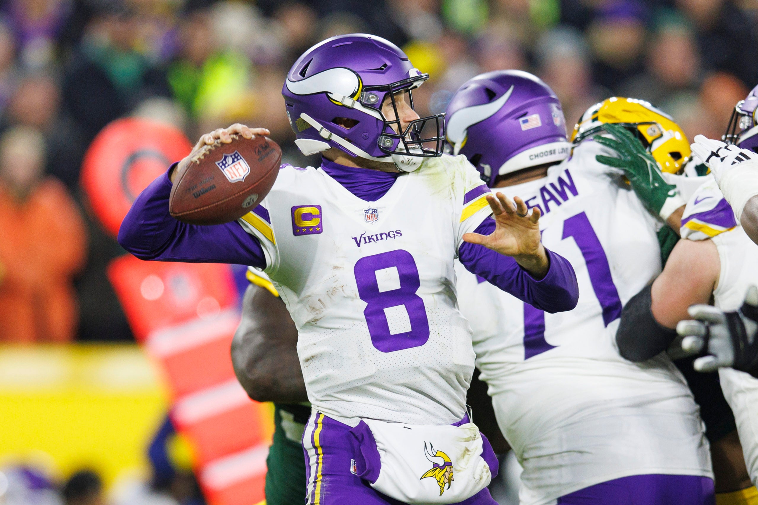 Jan 1, 2023; Green Bay, Wisconsin, USA;  Minnesota Vikings quarterback Kirk Cousins (8) throws a pass during the second quarter against the Green Bay Packers at Lambeau Field. Mandatory Credit: Jeff Hanisch-USA TODAY Sports