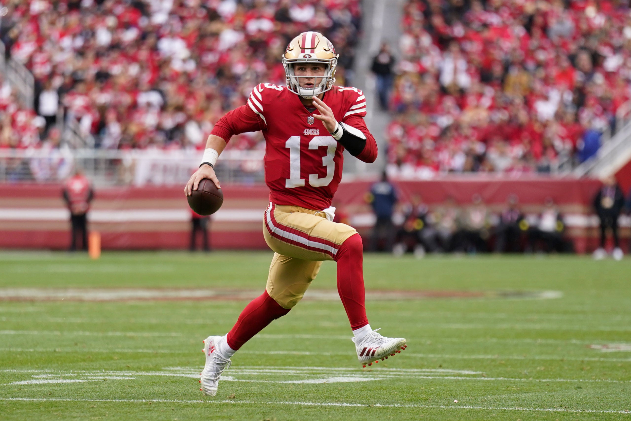 Jan 8, 2023; Santa Clara, California, USA; San Francisco 49ers quarterback Brock Purdy (13) runs the ball against the Arizona Cardinals in the third quarter at Levi's Stadium. Mandatory Credit: Cary Edmondson-USA TODAY Sports