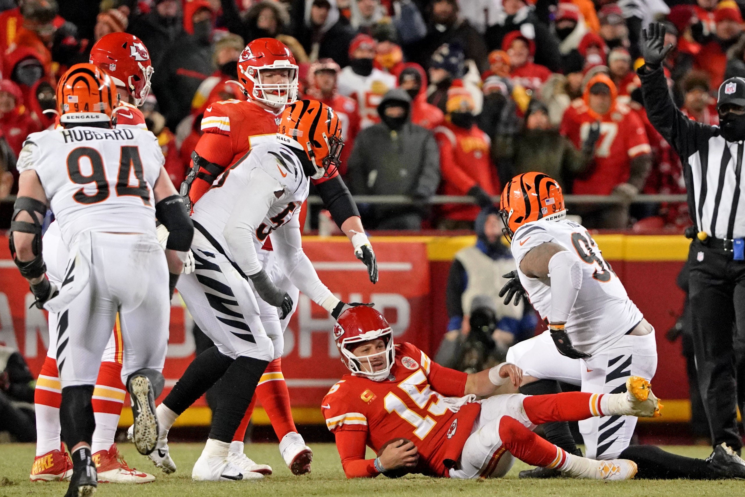 Jan 29, 2023; Kansas City, Missouri, USA; Kansas City Chiefs quarterback Patrick Mahomes (15) reacts after being sacked by Cincinnati Bengals defensive tackle BJ Hill (92) during the fourth quarter of the AFC Championship game at GEHA Field at Arrowhead Stadium. Mandatory Credit: Denny Medley-USA TODAY Sports