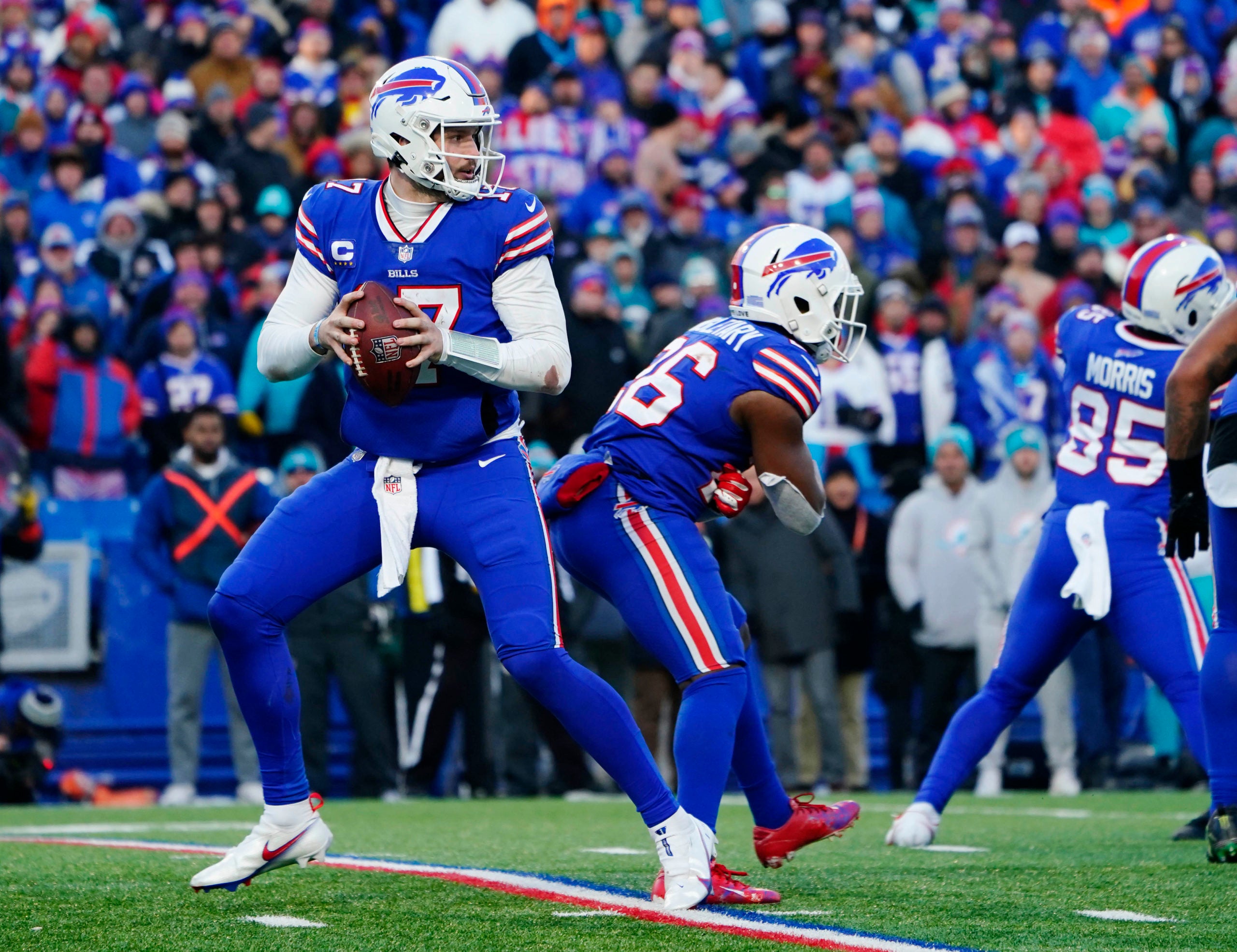 Jan 15, 2023; Orchard Park, NY, USA; Buffalo Bills quarterback Josh Allen (17) drops back to pass against the Miami Dolphins during the second half in a NFL wild card game at Highmark Stadium. Mandatory Credit: Gregory Fisher-USA TODAY Sports
