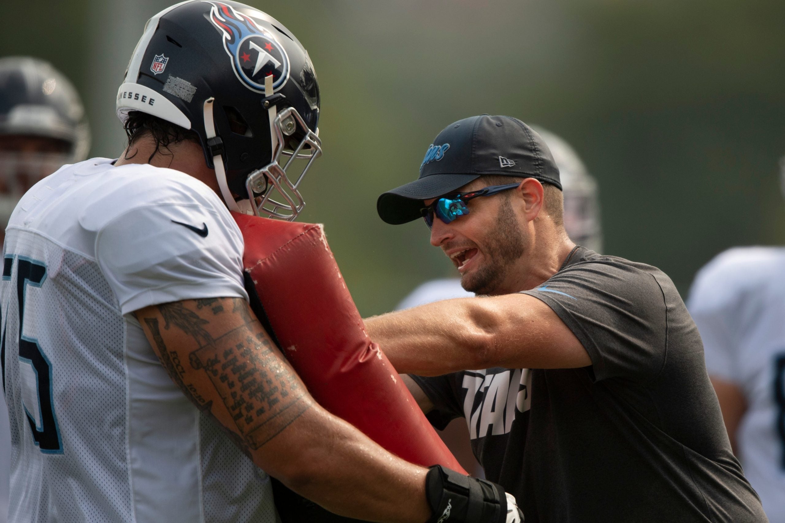 Tennessee Titans offensive line coach Keith Carter gives instruction to his players during a training camp practice at Saint Thomas Sports Park Friday, Aug. 6, 2021 in Nashville, Tenn. Nas 0806 Titans Camp 018