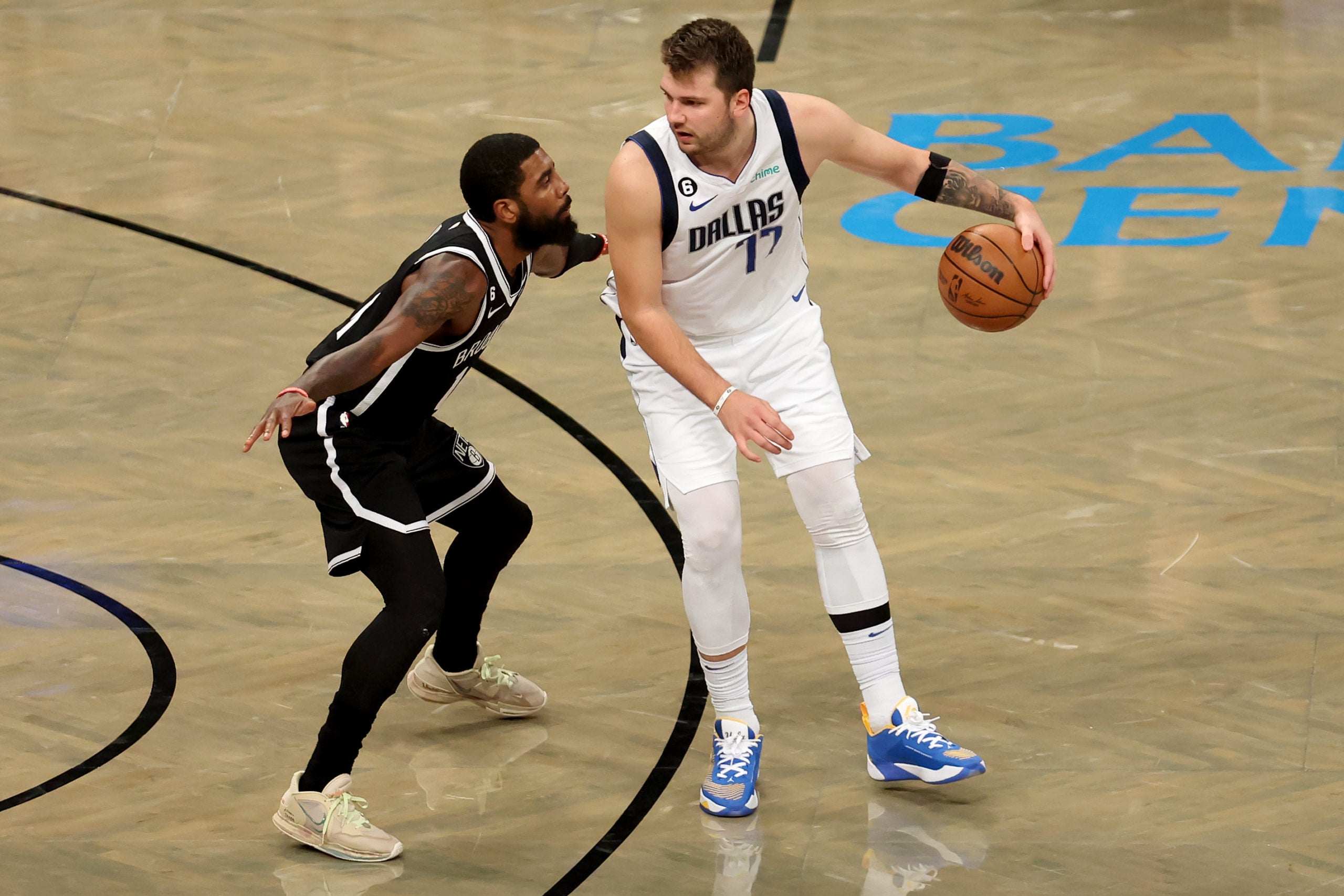 Kyrie Irving guards Luka Doncic.