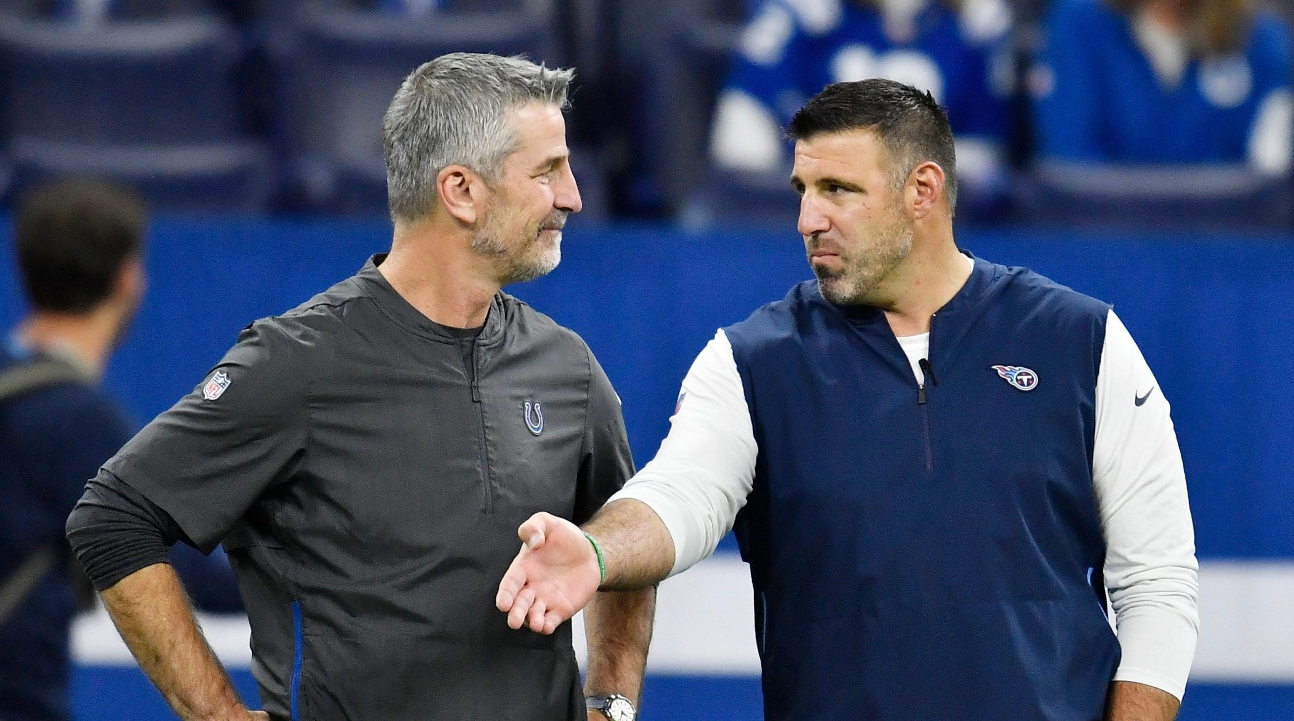 Titans head coach Mike Vrabel chats with Colts head coach Frank Reich before the game at Lucas Oil Stadium Sunday, Nov. 18, 2018, in Indianapolis, Ind. Gw59908