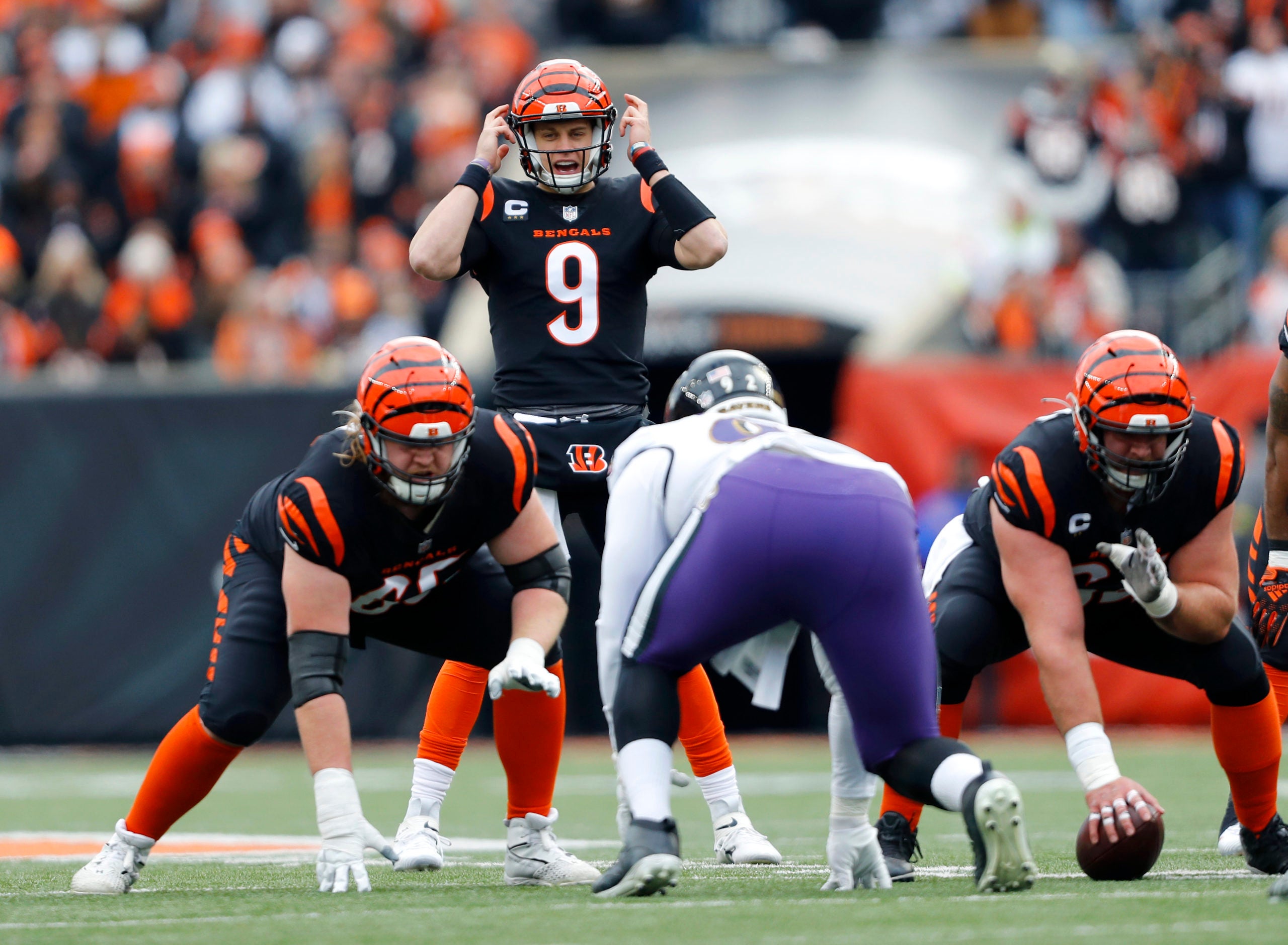 Jan 8, 2023; Cincinnati, Ohio, USA;  Cincinnati Bengals quarterback Joe Burrow (9) audibles at the line during the second quarter against the Baltimore Ravens at Paycor Stadium. Mandatory Credit: Joseph Maiorana-USA TODAY Sports