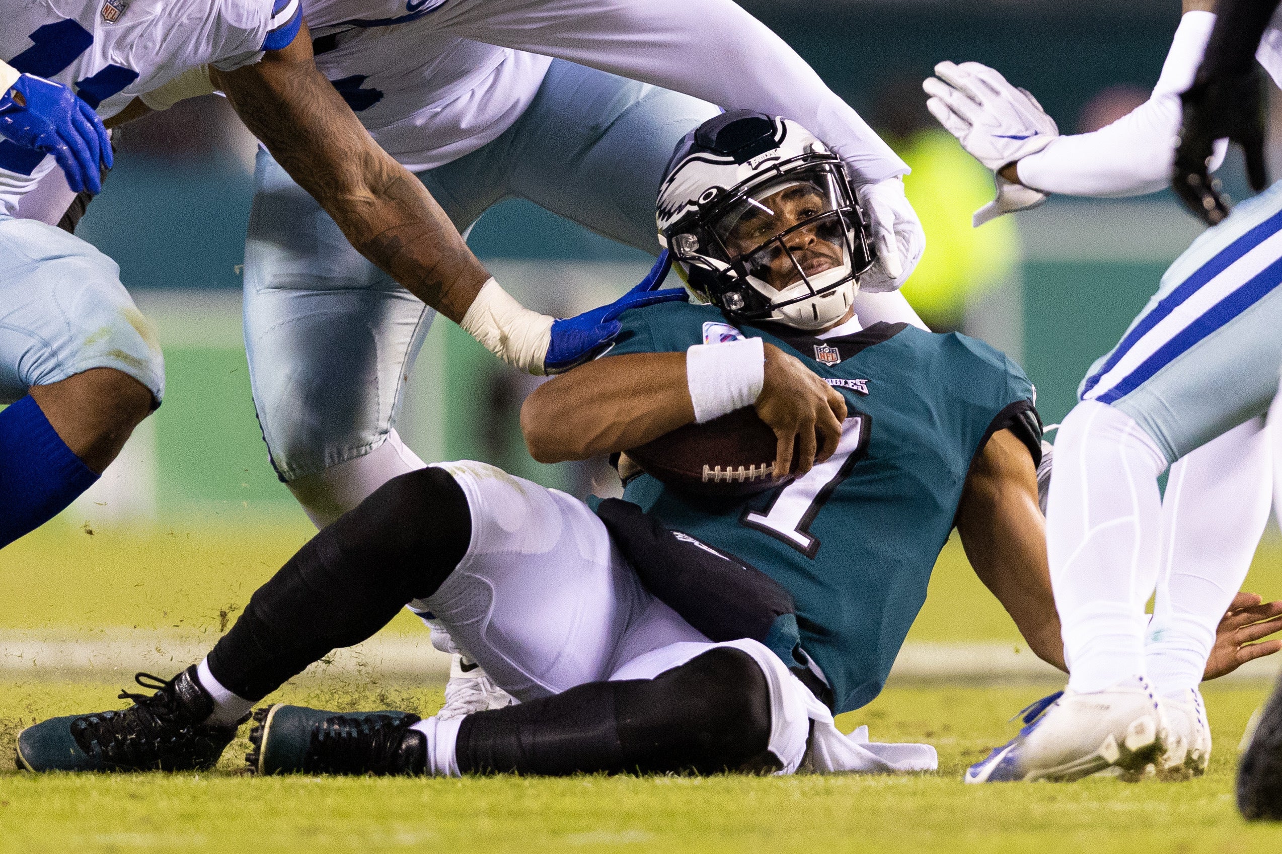 Oct 16, 2022; Philadelphia, Pennsylvania, USA; Philadelphia Eagles quarterback Jalen Hurts (1) is tackled by Dallas Cowboys defensive tackle Quinton Bohanna (98) and linebacker Micah Parsons (11) during the fourth quarter at Lincoln Financial Field. Mandatory Credit: Bill Streicher-USA TODAY Sports