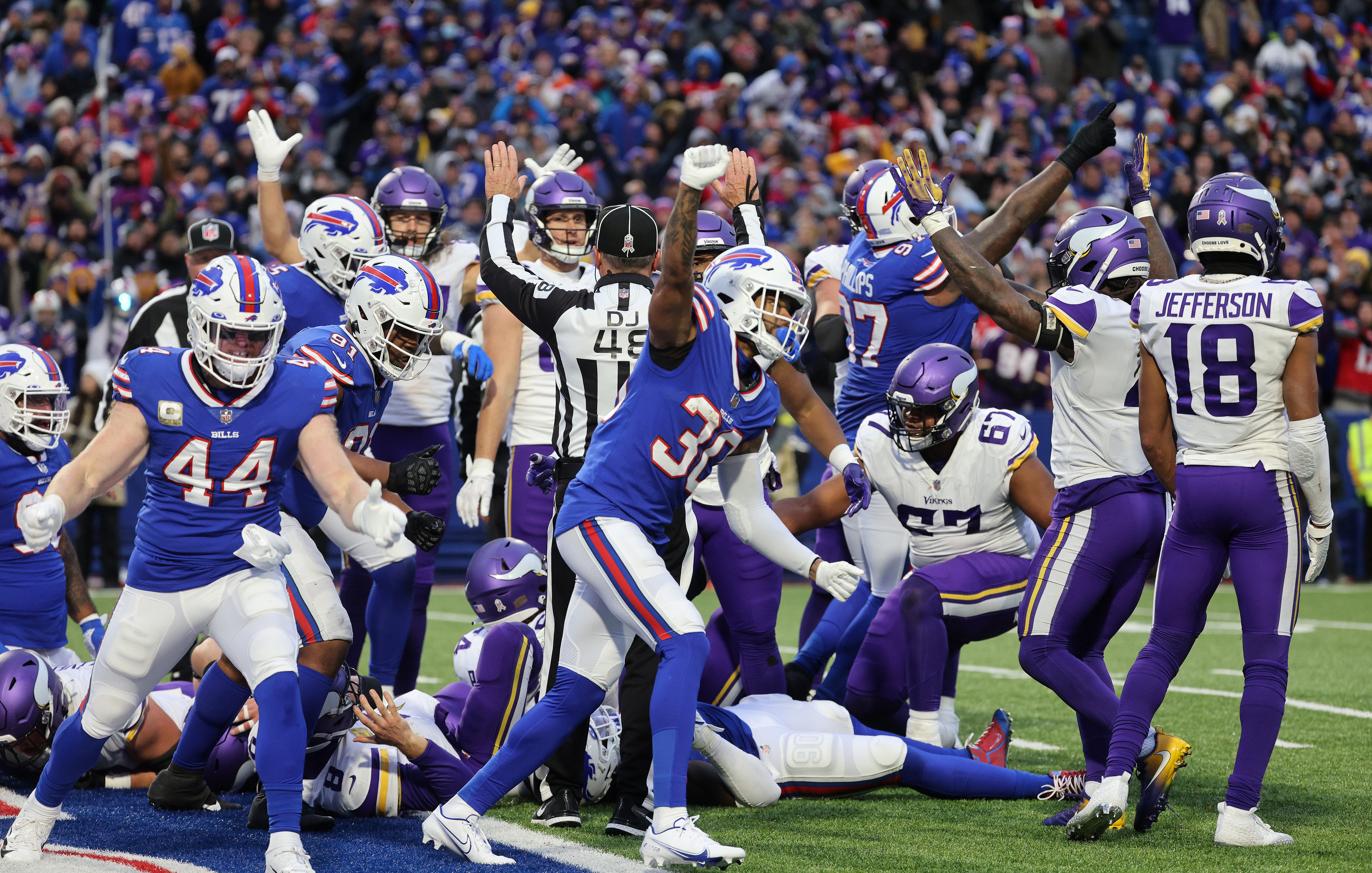 The Bills defense celebrates stopping Vikings Kirk Cousins at the goal line.