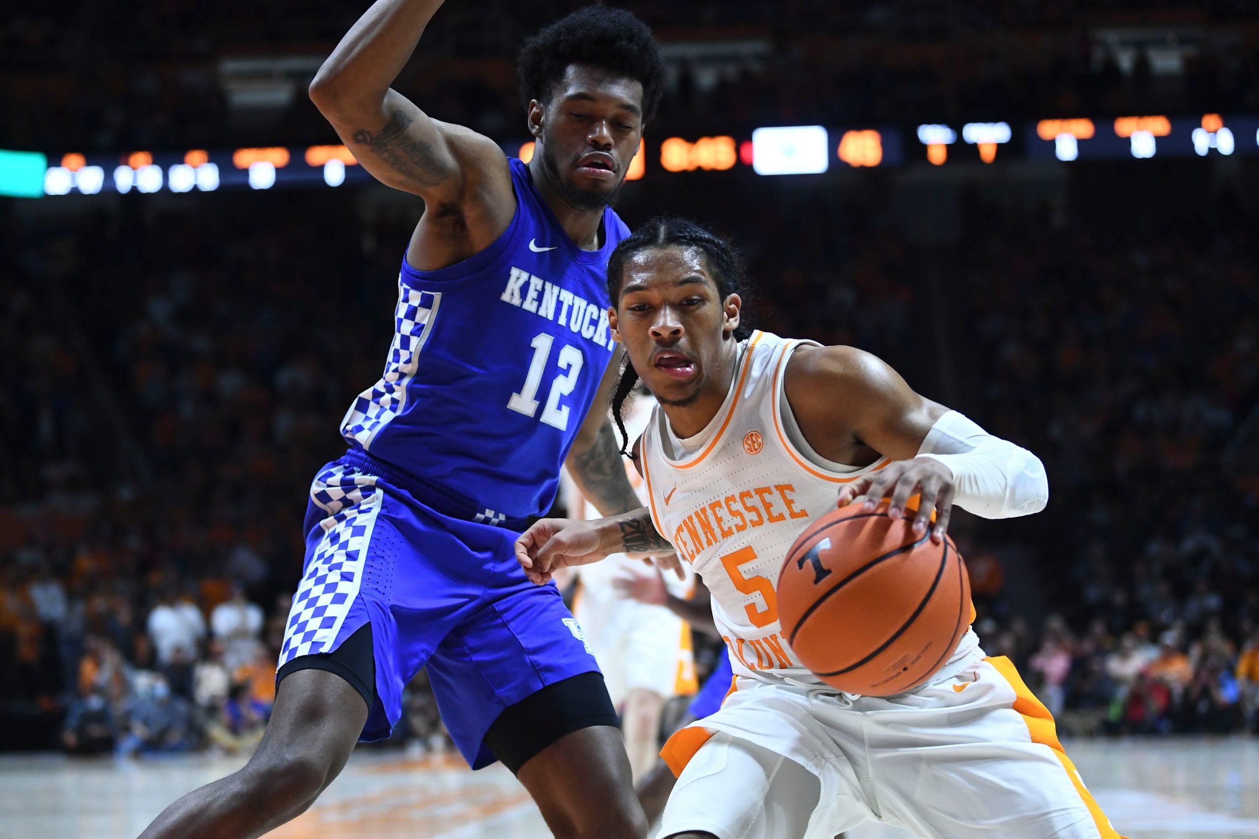 Tennessee guard Zakai Zeigler (5) is guarded by Kentucky forward Keion Brooks Jr. (12) during the NCAA college basketball game between the Kentucky Wildcats and Tennessee Volunteers in Knoxville, Tenn. on Tuesday, February 15, 2022. Px Uthoops Kentucky Syndication The Knoxville News Sentinel
