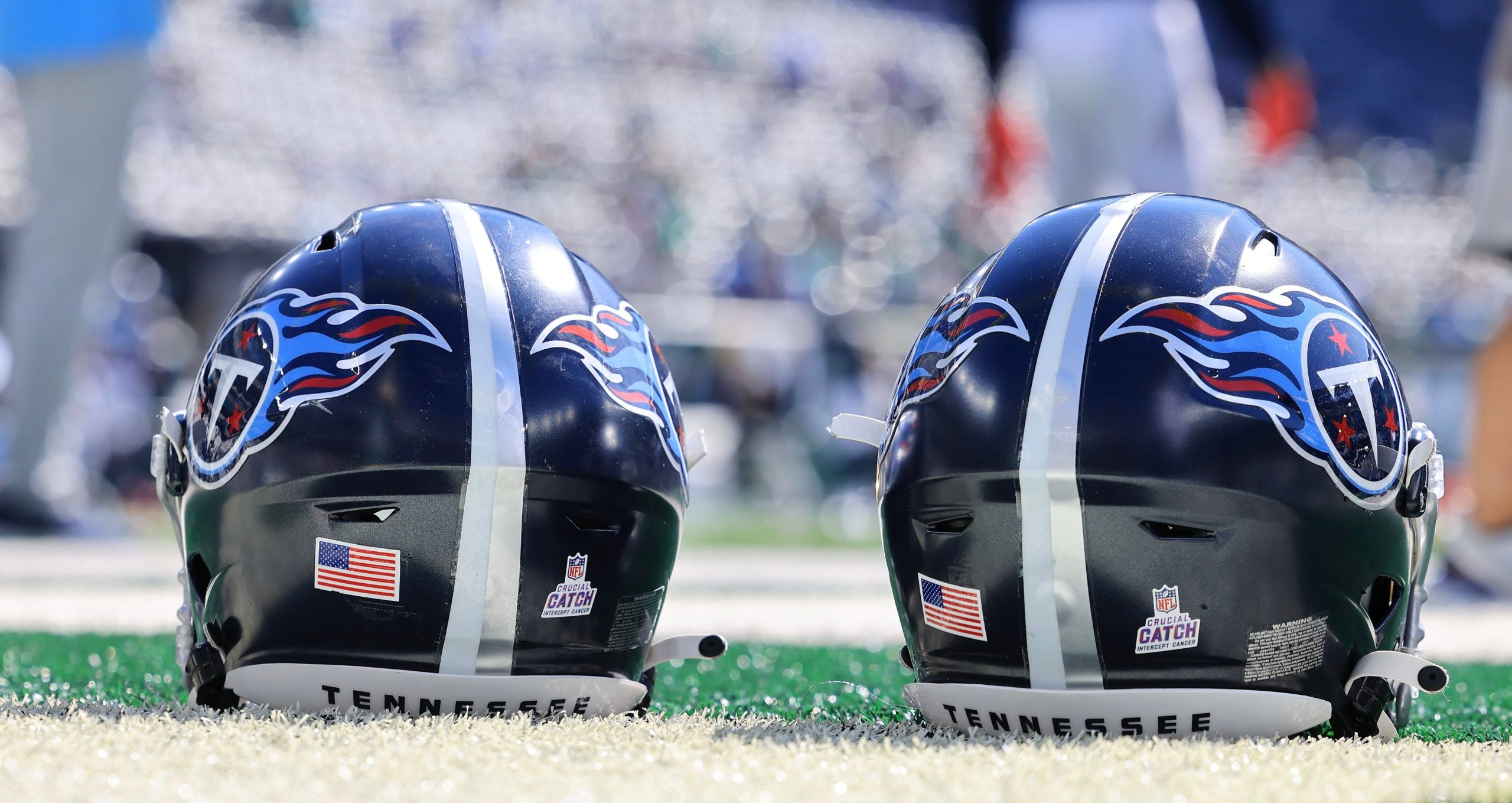 Oct 3, 2021; East Rutherford, New Jersey, USA; Tennessee Titans helmets rest on the field before the game between the New York Jets and the Titans at MetLife Stadium. Mandatory Credit: Vincent Carchietta-USA TODAY Sports