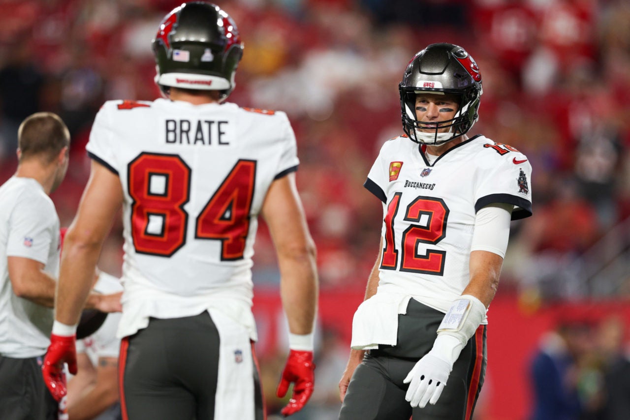 Oct 2, 2022; Tampa, Florida, USA;  Tampa Bay Buccaneers quarterback Tom Brady (12) and tight end Cameron Brate (84) warms up before a game against the Kansas City Chiefs at Raymond James Stadium. Mandatory Credit: Nathan Ray Seebeck-USA TODAY Sports