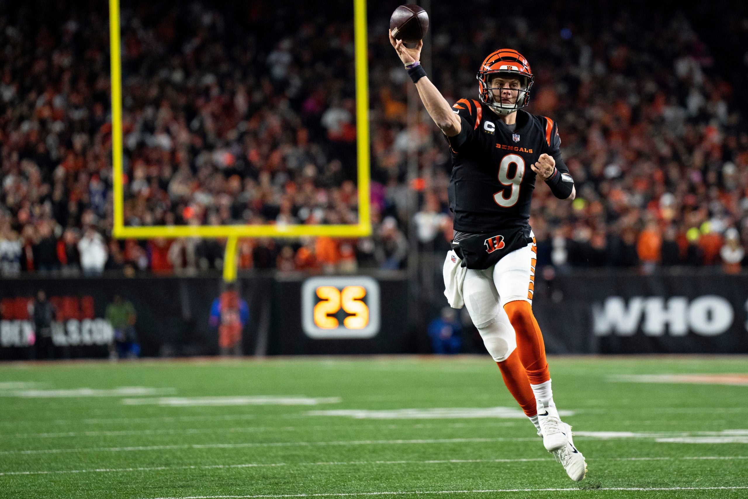 Cincinnati Bengals quarterback Joe Burrow (9) throws to Cincinnati Bengals wide receiver Tee Higgins (85) to convert a 2-point conversion in the third quarter during an NFL wild-card playoff football game between the Baltimore Ravens and the Cincinnati Bengals, Sunday, Jan. 15, 2023, at Paycor Stadium in Cincinnati. Baltimore Ravens At Cincinnati Bengals Afc Wild Card Jan 15 211