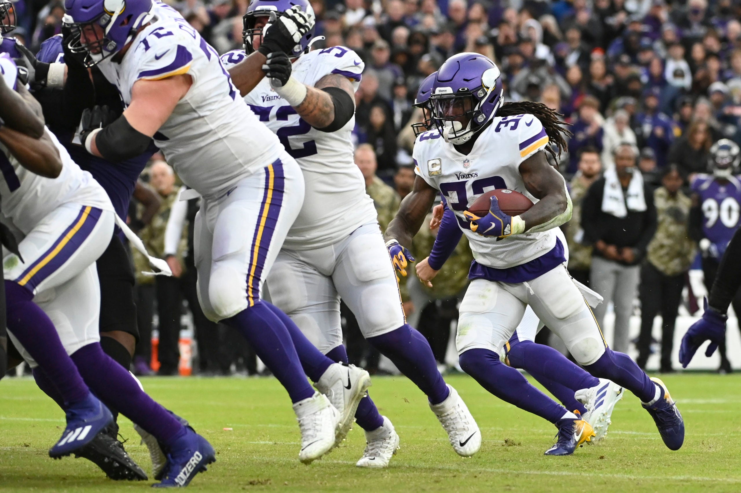 Nov 7, 2021; Baltimore, Maryland, USA;  Minnesota Vikings running back Dalvin Cook (33) rushes behind the offensive line during the second half against the Baltimore Ravens at M&T Bank Stadium. Mandatory Credit: Tommy Gilligan-USA TODAY Sports