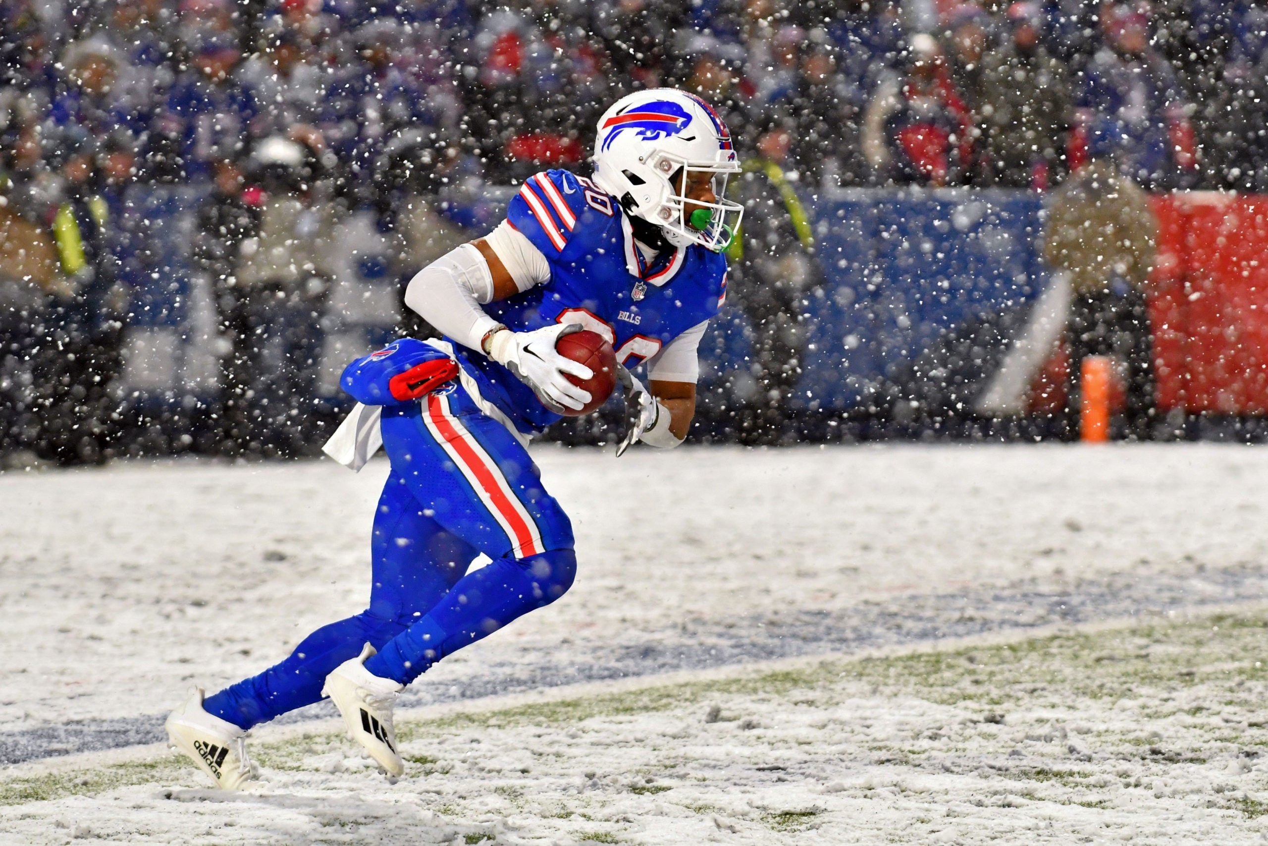 Jan 22, 2023; Orchard Park, New York, USA; Buffalo Bills running back Nyheim Hines (20) runs with the ball against the Cincinnati Bengals during the third quarter of an AFC divisional round game at Highmark Stadium. Mandatory Credit: Mark Konezny-USA TODAY Sports