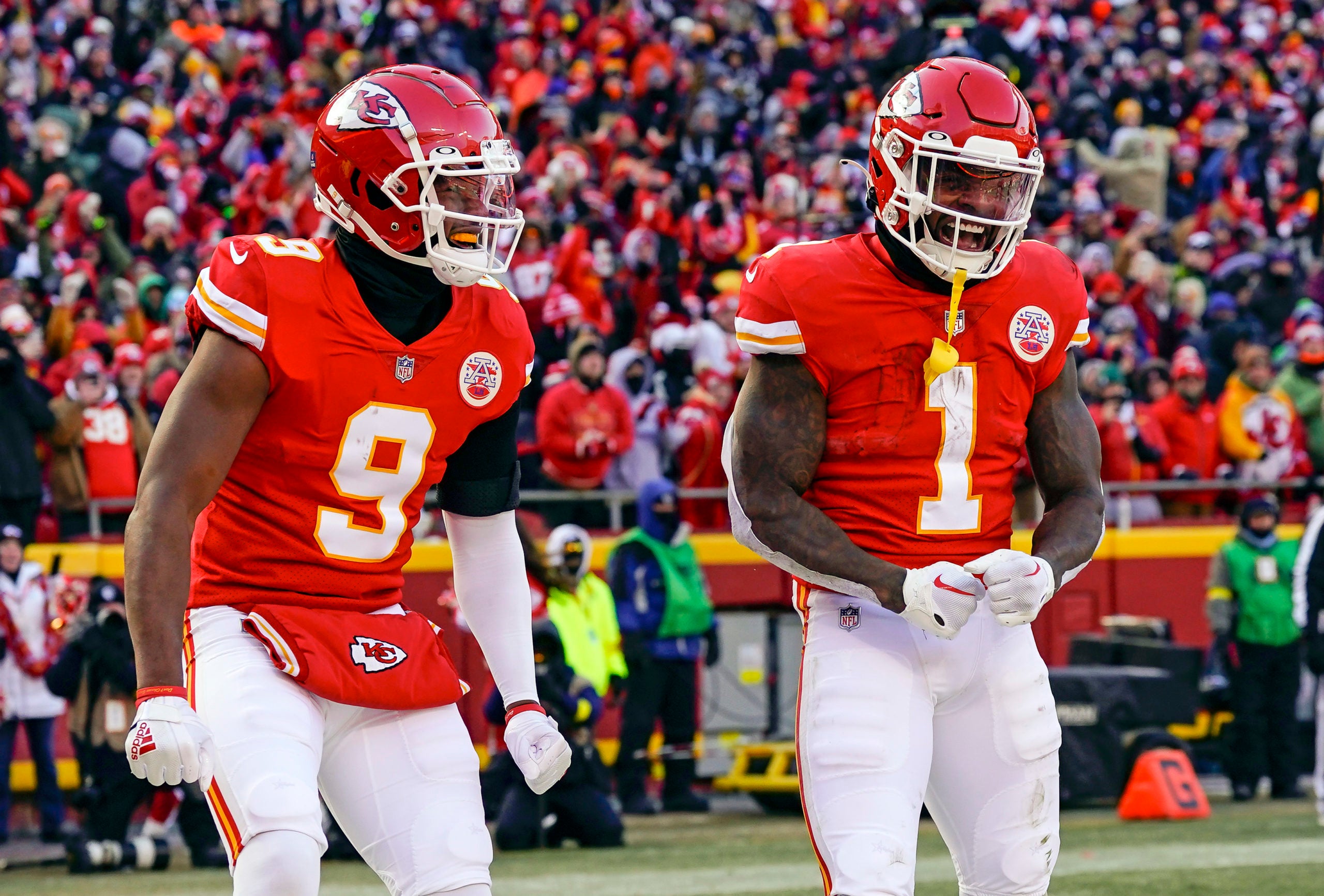 Dec 24, 2022; Kansas City, Missouri, USA; Kansas City Chiefs running back Jerick McKinnon (1) celebrates with wide receiver JuJu Smith-Schuster (9) after scoring a touchdown during the first half against the Seattle Seahawks at GEHA Field at Arrowhead Stadium. Mandatory Credit: Jay Biggerstaff-USA TODAY Sports
