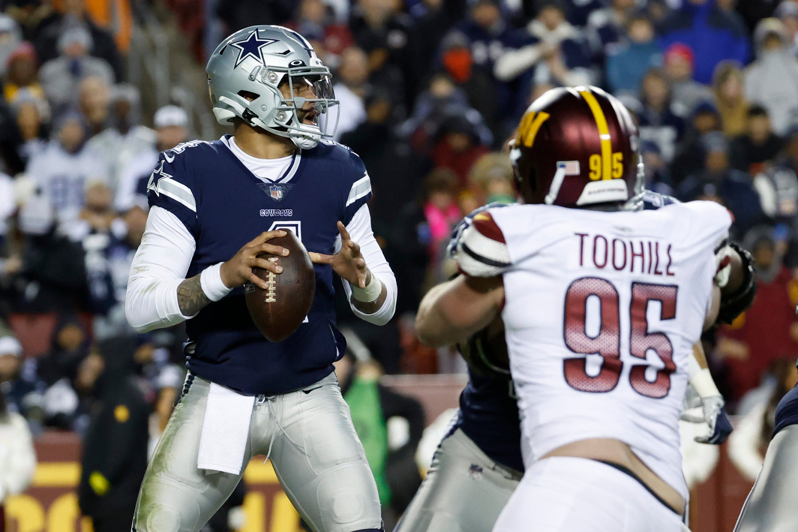 Jan 8, 2023; Landover, Maryland, USA; Dallas Cowboys quarterback Dak Prescott (4) prepares to pass the ball as Washington Commanders defensive end Casey Toohill (95) during the third quarter at FedExField. Mandatory Credit: Geoff Burke-USA TODAY Sports