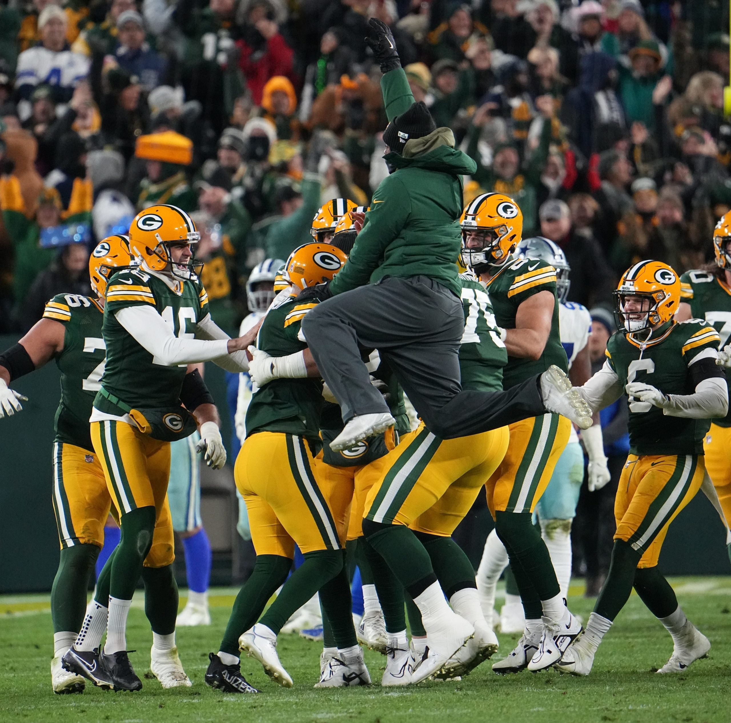 Green Bay Packers place kicker Mason Crosby is  swarmed by teammates after kicking the game-winning field goal during overtime during in their game Sunday, November 13, 2022 at Lambeau Field in Green Bay, Wis. The Green Bay Packers beat the Dallas Cowboys 31-28 in overtime. Packers13 1