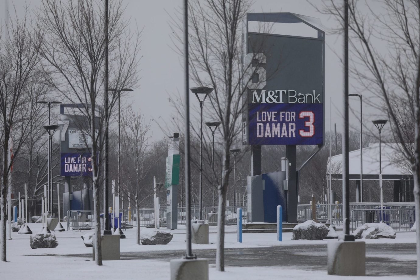 Highmark Stadium, home of the Buffalo Bills, looms over Abbott Road in Orchard Park on Jan. 13.  The "Love for Damar 3" electronic signs are displayed on all the gate signs around the stadium. Love For Damar 3 Signs Buffalo Bills