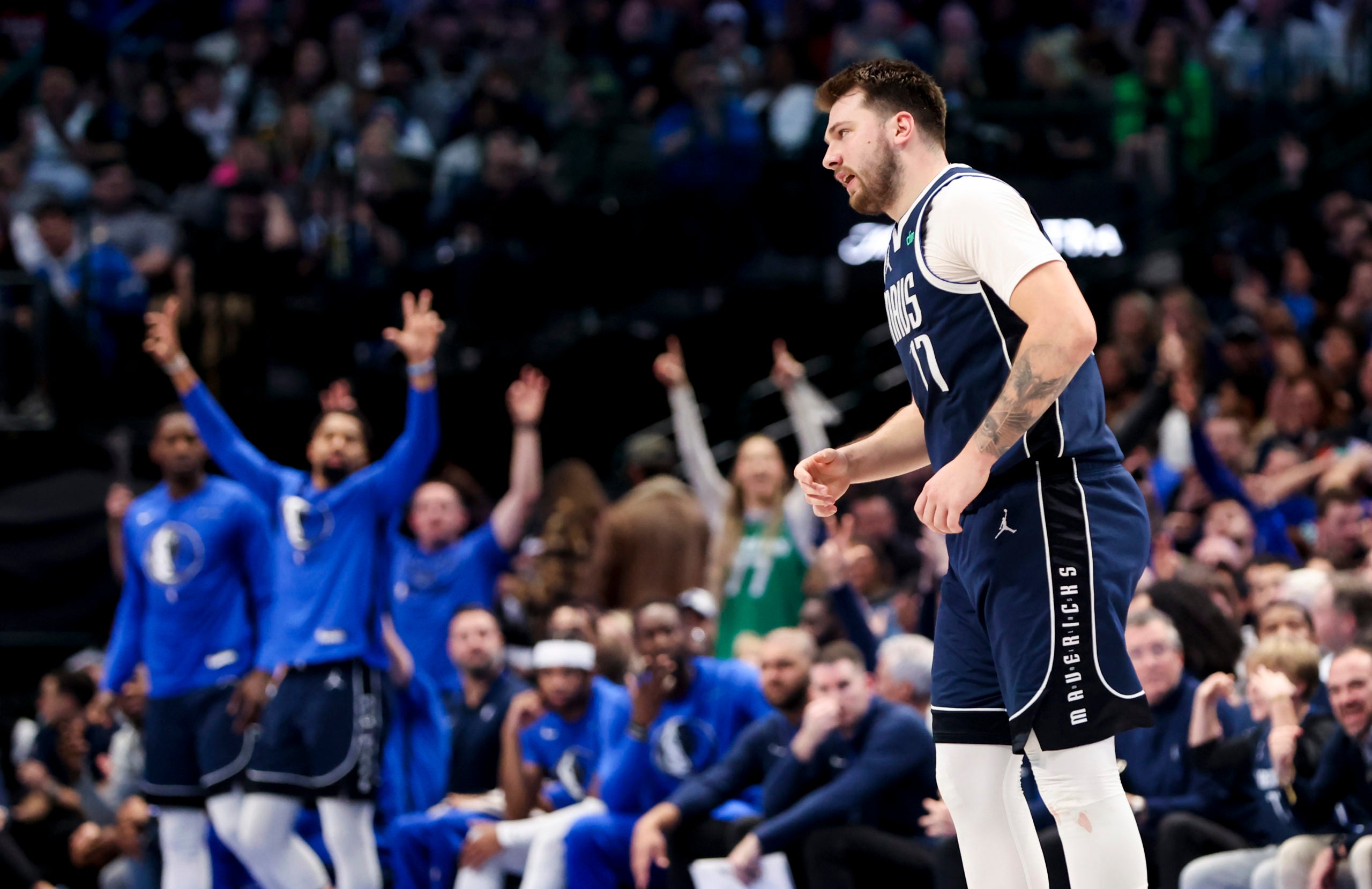 Luka Doncic walks back on defense.