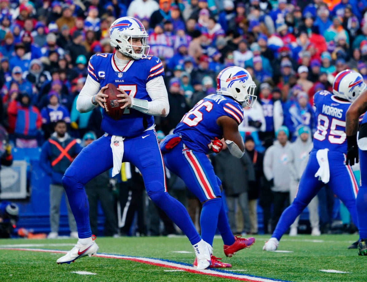 Jan 15, 2023; Orchard Park, NY, USA; Buffalo Bills quarterback Josh Allen (17) drops back to pass against the Miami Dolphins during the second half in a NFL wild card game at Highmark Stadium. Mandatory Credit: Gregory Fisher-USA TODAY Sports