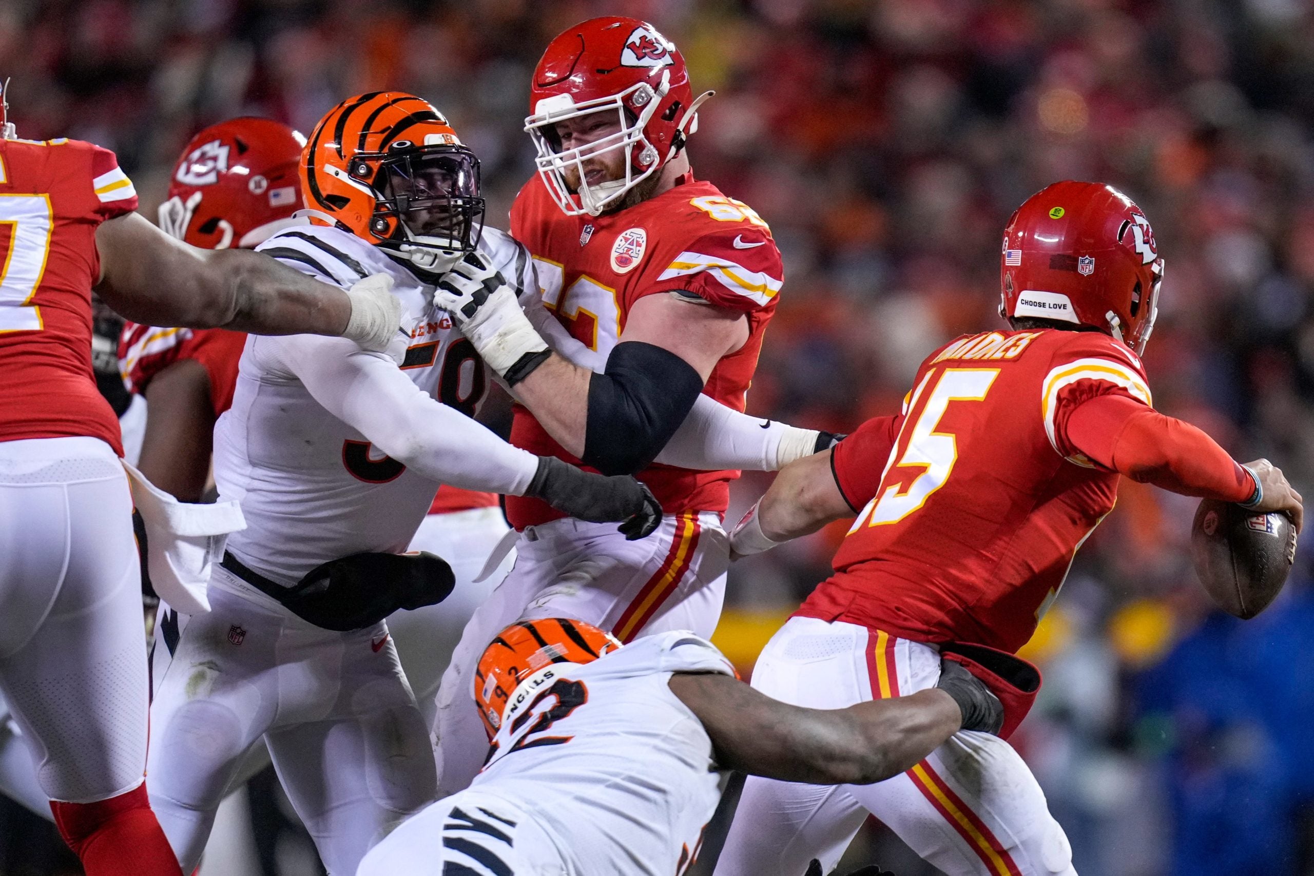 Cincinnati Bengals defensive end Joseph Ossai (58) and defensive tackle BJ Hill (92) wrap up Kansas City Chiefs quarterback Patrick Mahomes (15) in the fourth quarter of the AFC championship NFL game between the Cincinnati Bengals and the Kansas City Chiefs, Sunday, Jan. 29, 2023, at Arrowhead Stadium in Kansas City, Mo. The Kansas City Chiefs advanced to the Super Bowl with a 23-20 win over the Bengals. Cincinnati Bengals At Kansas City Chiefs Afc Championship Jan 29 665