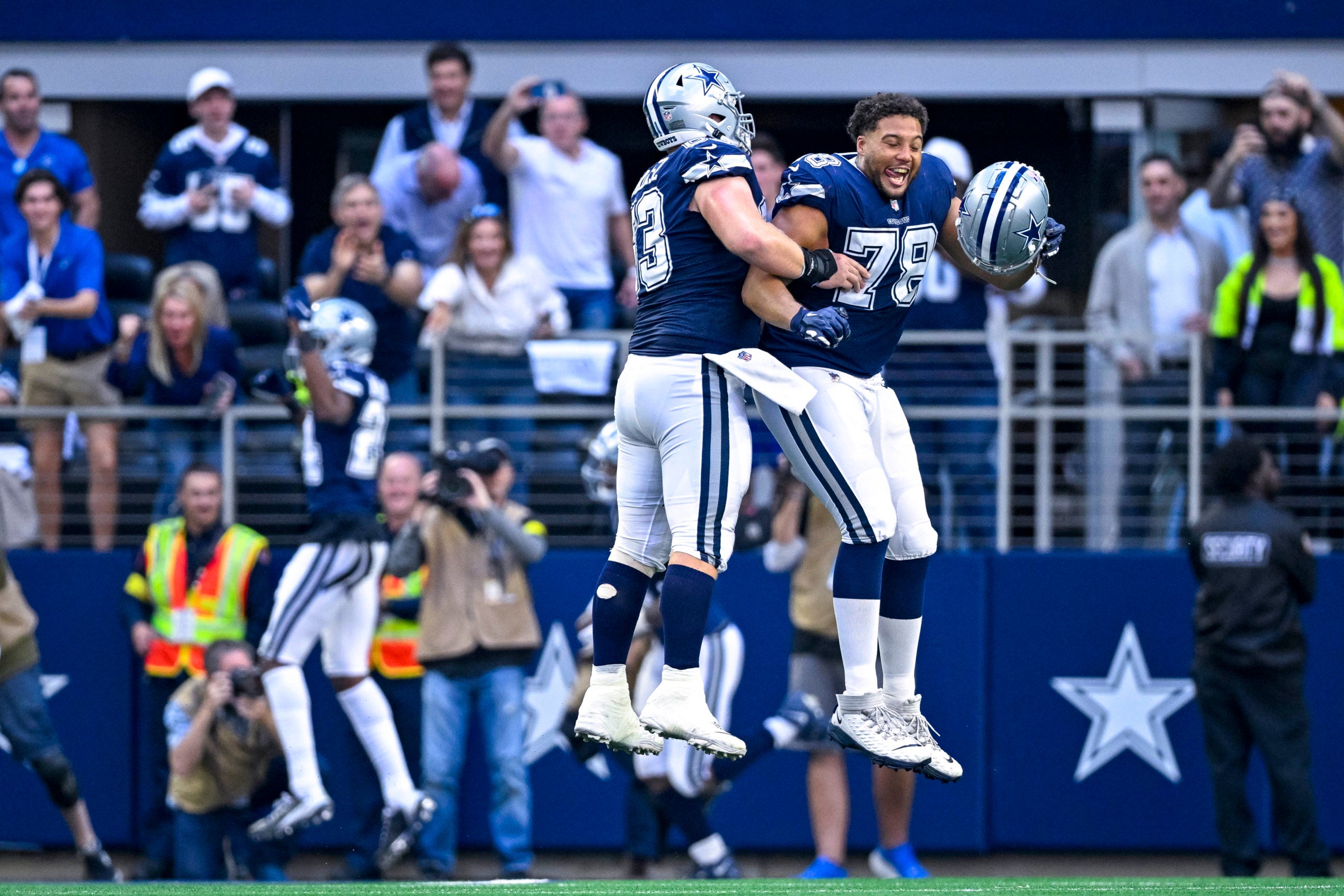 Oct 30, 2022; Arlington, Texas, USA; Dallas Cowboys center Tyler Biadasz (63) and offensive tackle Terence Steele (78) celebrate linebacker Micah Parsons (11)  fumble return for a touchdown against the Chicago Bears during the second half at AT&T Stadium. Mandatory Credit: Jerome Miron-USA TODAY Sports