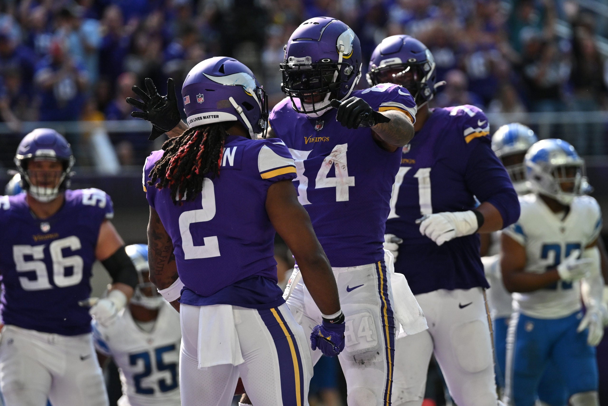 Sep 25, 2022; Minneapolis, Minnesota, USA; Minnesota Vikings running back Alexander Mattison (2) reacts with tight end Irv Smith Jr. (84) after scoring a touchdown against the Detroit Lions during the fourth quarter at U.S. Bank Stadium. Mandatory Credit: Jeffrey Becker-USA TODAY Sports