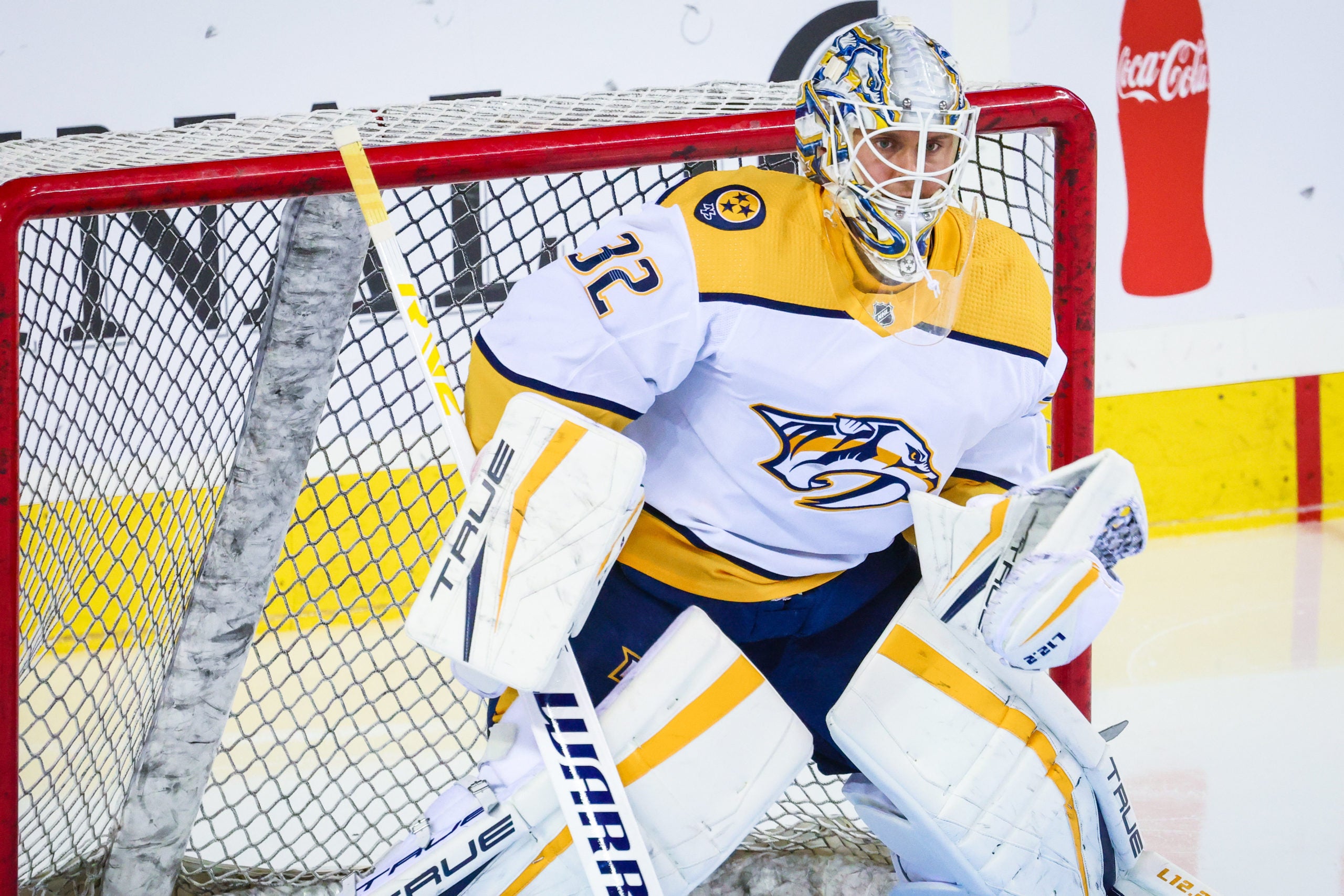 Nashville Predators goaltender Kevin Lankinen guards the net.