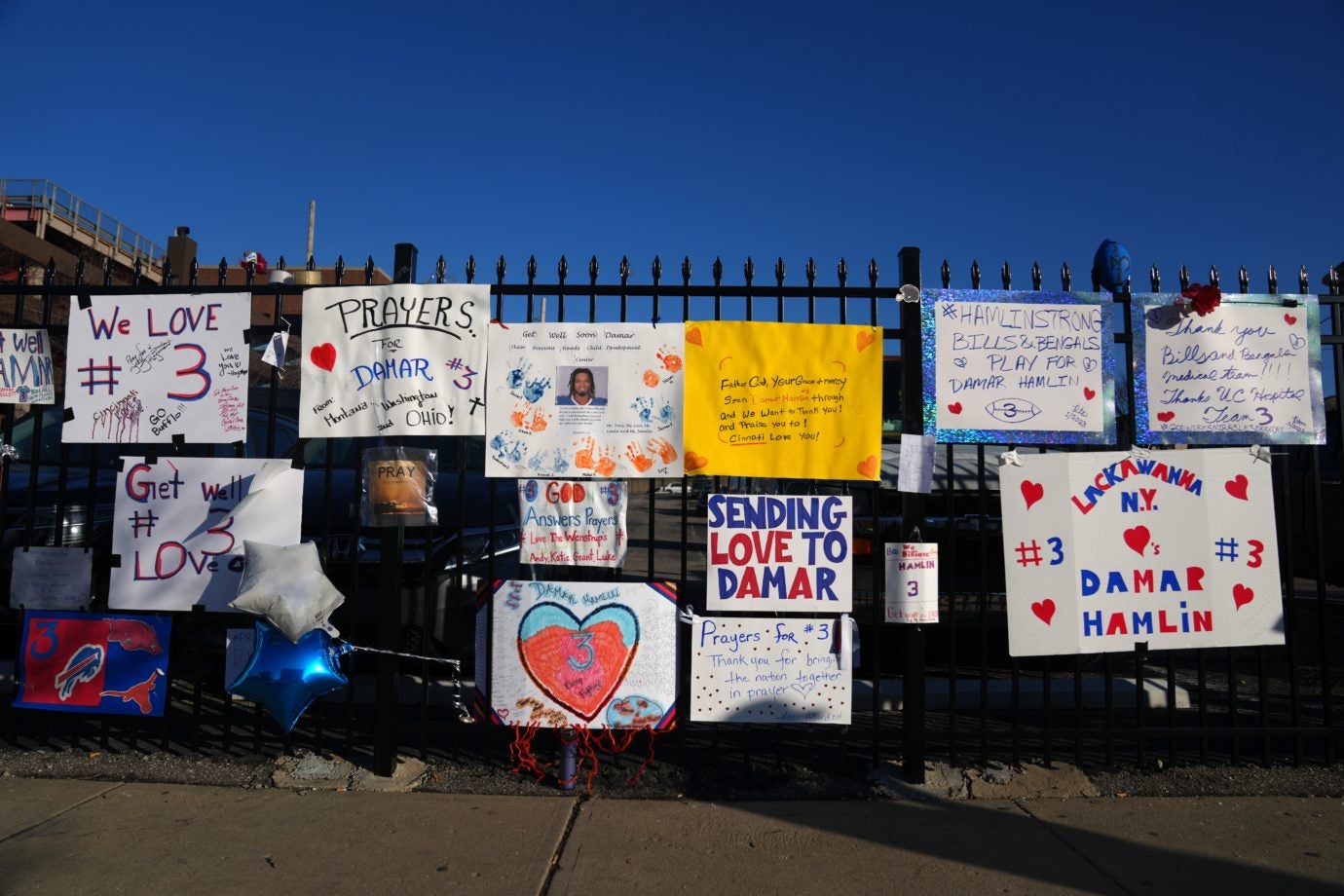 Notes and cards left in support of Buffalo Bills safety Damar Hamlin are pinned to a fence near the main entrance of the University of Cincinnati Medical Center, Monday, Jan. 9, 2023, in Cincinnati. Hamlin suffered cardiac arrest during a Monday Night Football game against the Cincinnati Bengals on Jan. 2, and was revived on the field before being taken to the hospital. He was released on Monday, Jan. 9, 2023. The game was suspended and then canceled by the NFL. Damar Hamlin Prayer Wall Jan 9 0020