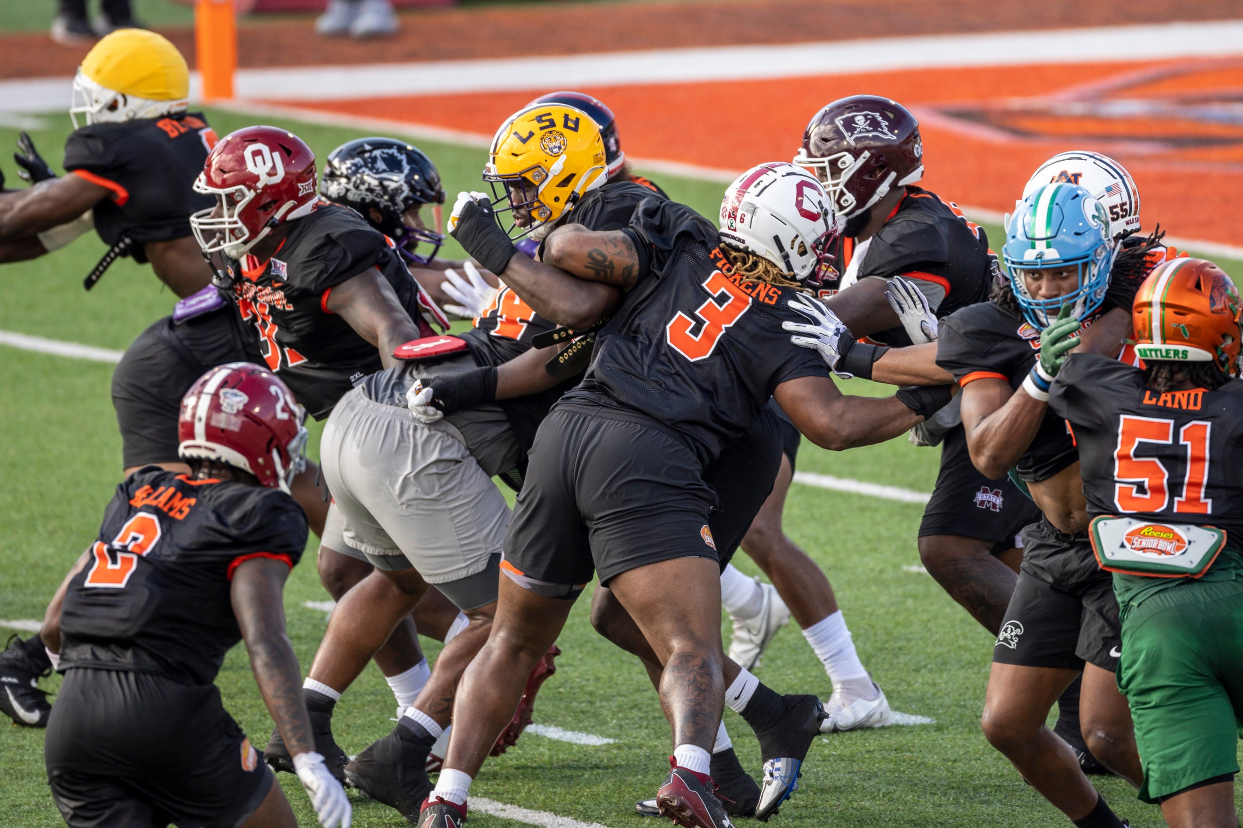 Jan 31, 2023; Mobile, AL, USA; American defensive lineman Ali Gaye of LSU (11) and American defensive lineman Zacch Pickens of South Carolina (3) battle inside a scrum during the first day of Senior Bowl week at Hancock Whitney Stadium in Mobile. Mandatory Credit: Vasha Hunt-USA TODAY Sports