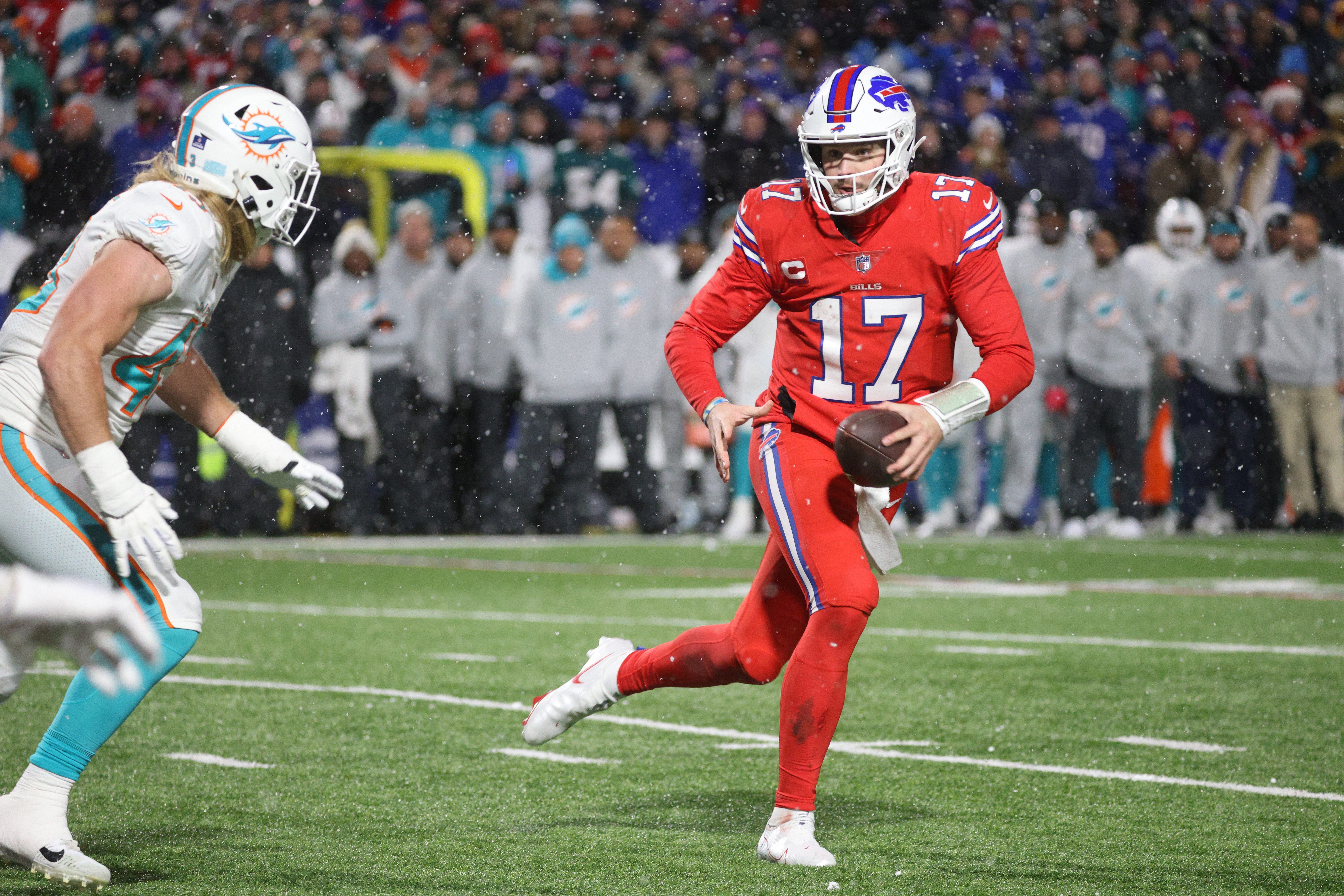 Bills quarterback Josh Allen rolls away from pressure.
