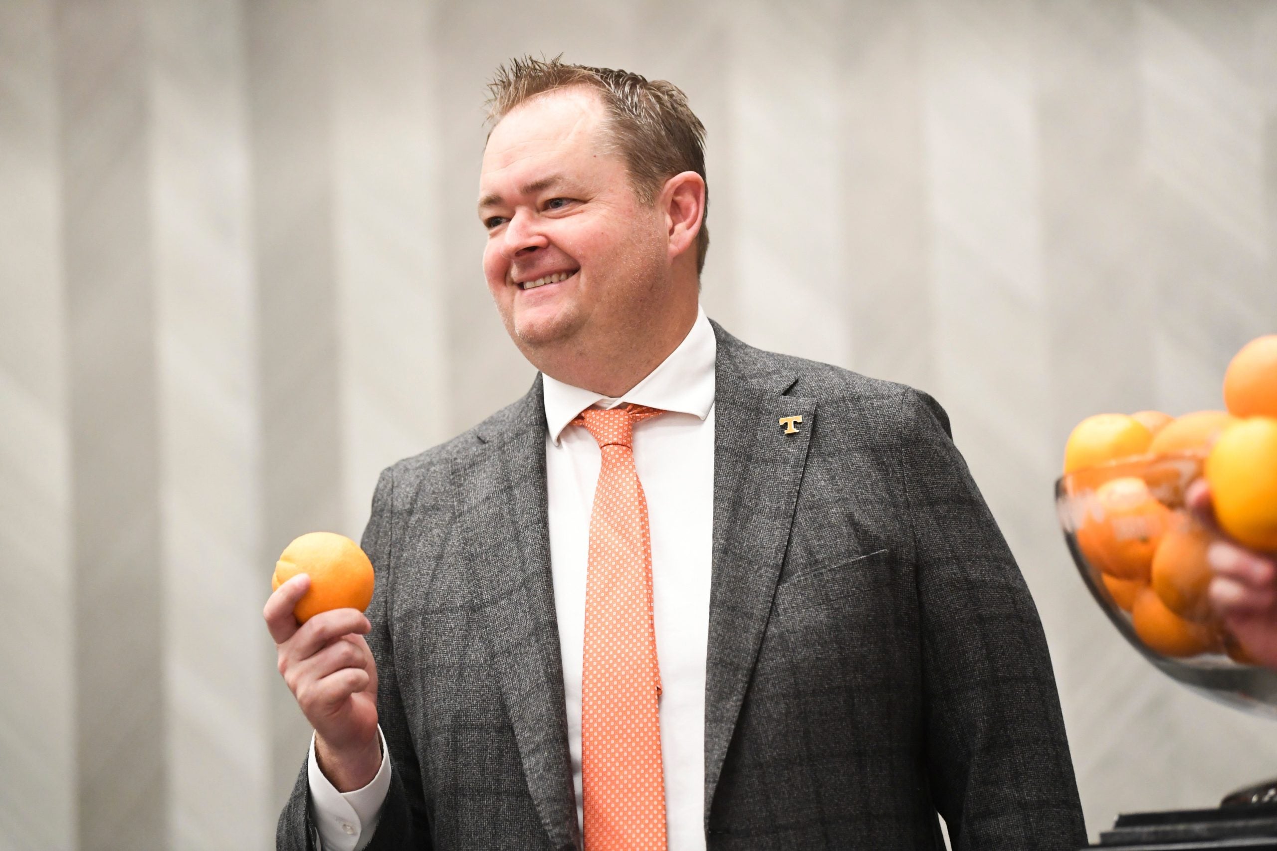 Tennessee head coach Josh Heupel poses for a photo in front of the Orange Bowl Trophy at the Le Meridien Dania Beach hotel before the Orange Bowl, Thursday, Dec. 29, 2022. Headcoachpresser1229 0117