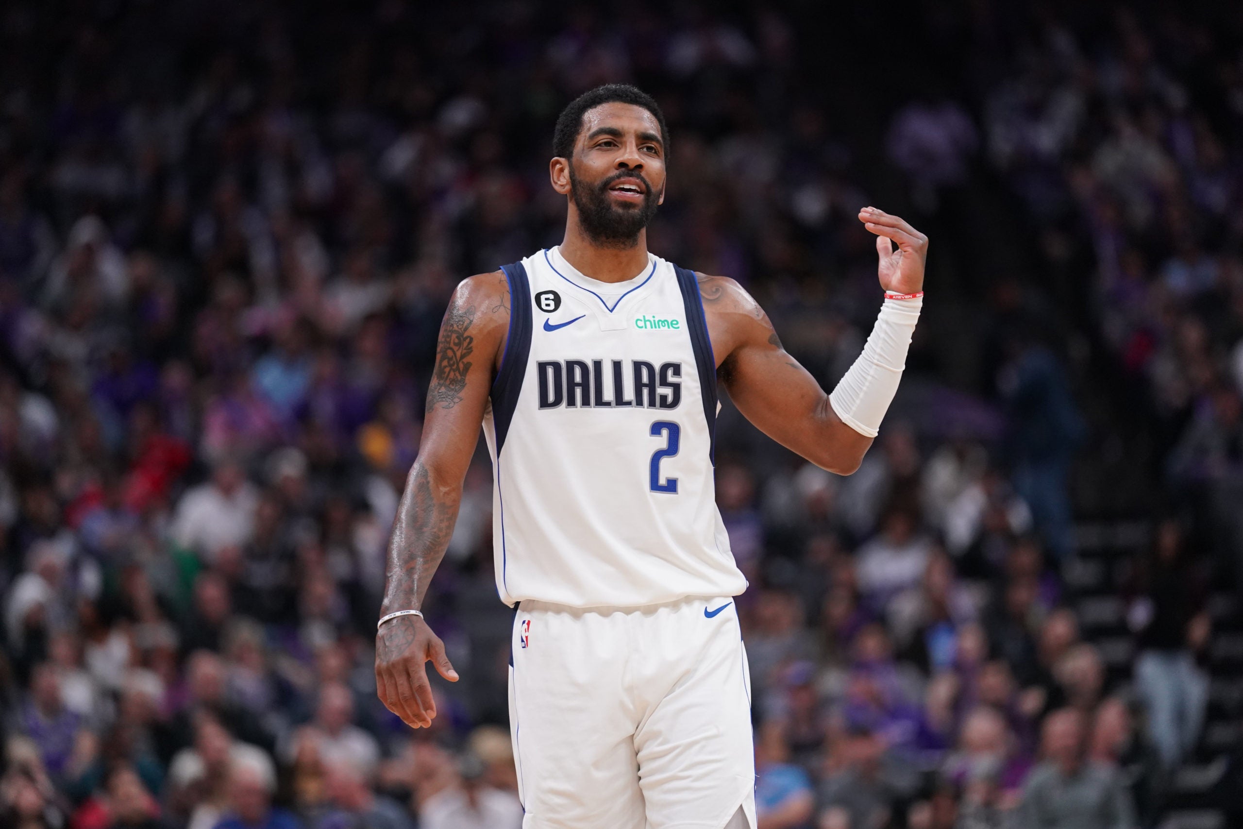 Sacramento, California, USA; Dallas Mavericks guard Kyrie Irving (2) talks with teammates after a play against the Sacramento Kings in the fourth quarter at the Golden 1 Center