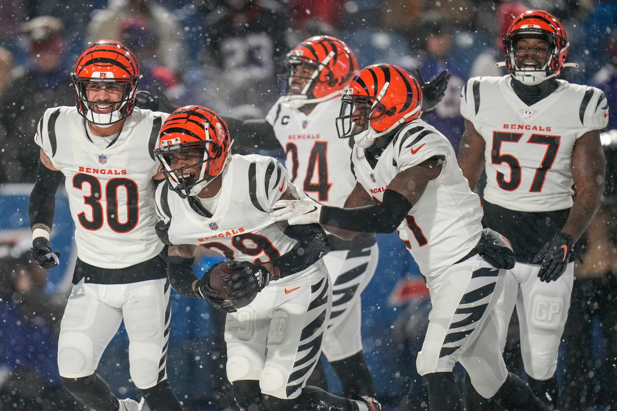 The Bengals defense celebrates as Cincinnati Bengals cornerback Cam Taylor-Britt (29) comes down with an interception to seal the game in the fourth quarter of the NFL divisional playoff football game between the Cincinnati Bengals and the Buffalo Bills, Sunday, Jan. 22, 2023, at Highmark Stadium in Orchard Park, N.Y. The Bengals won 27-10 to advance to the AFC Championship game against the Kansas City Chiefs. Cincinnati Bengals At Buffalo Bills Afc Divisional Jan 22 165 Syndication The Enquirer