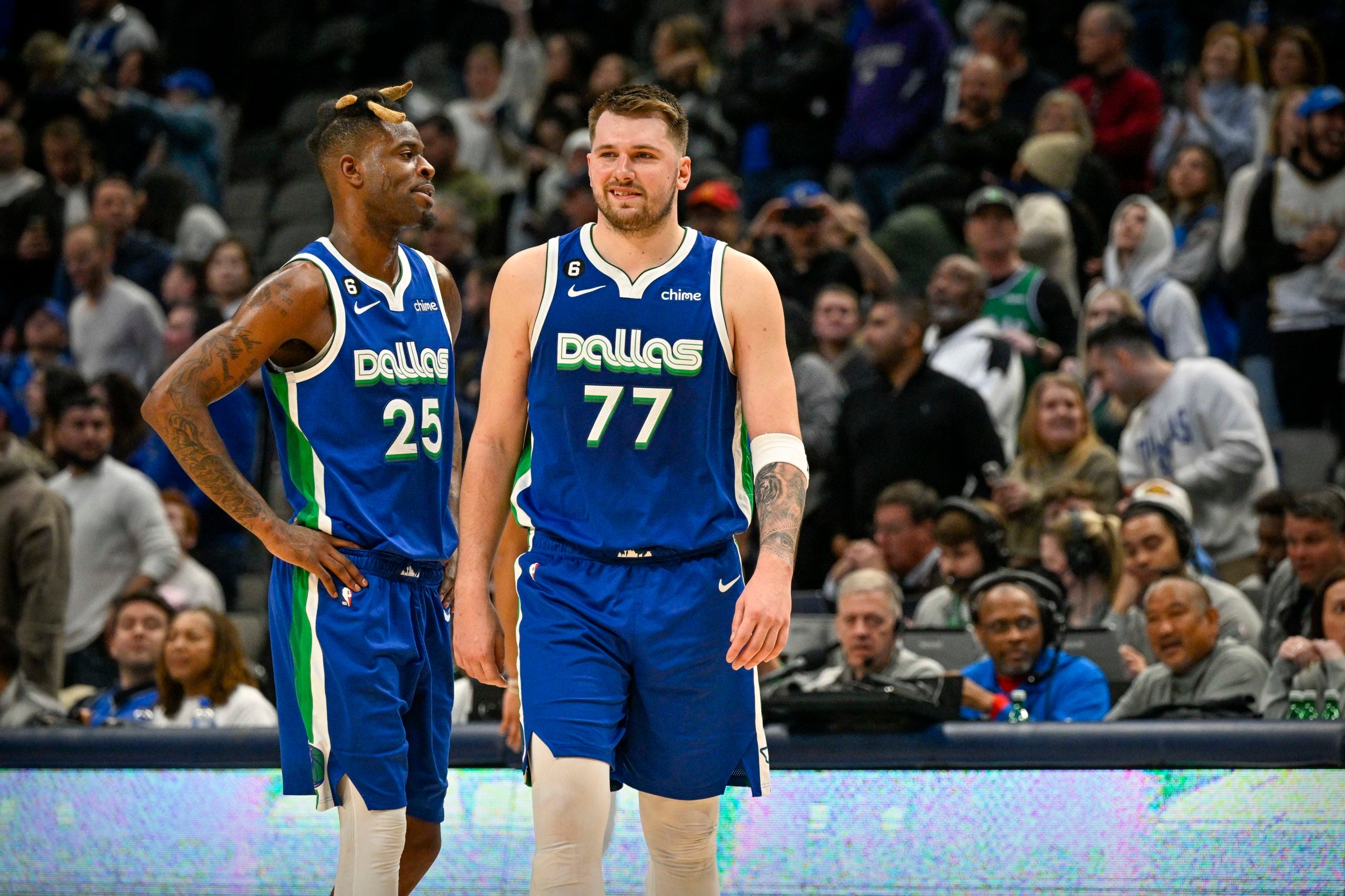 Luka Doncic and Reggie Bullock check into game against Detroit Pistons.