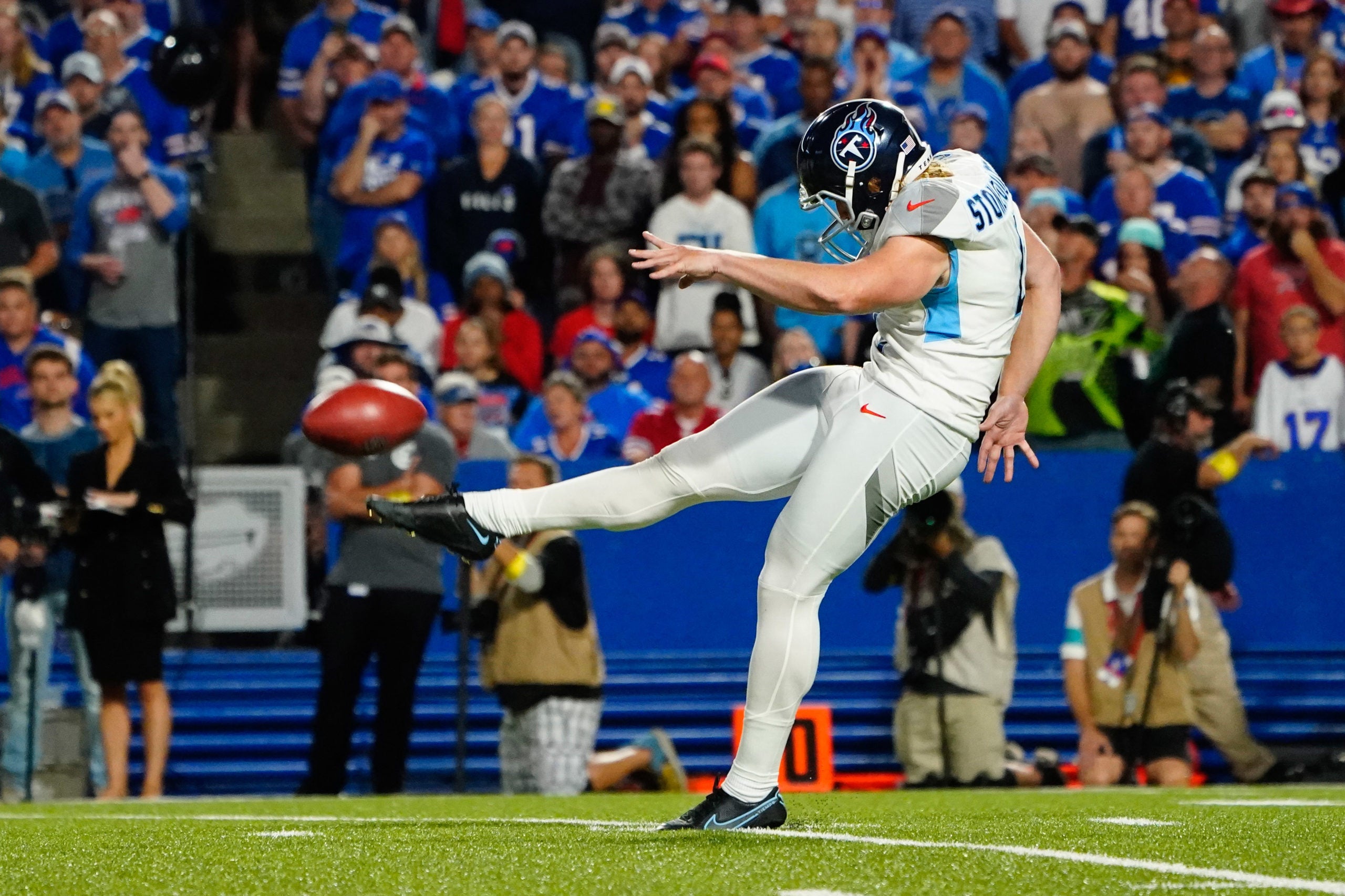 Sep 19, 2022; Orchard Park, New York, USA; Tennessee Titans punter Ryan Stonehouse (4) punts the ball against the Buffalo Bills during the first half at Highmark Stadium. Mandatory Credit: Gregory Fisher-USA TODAY Sports