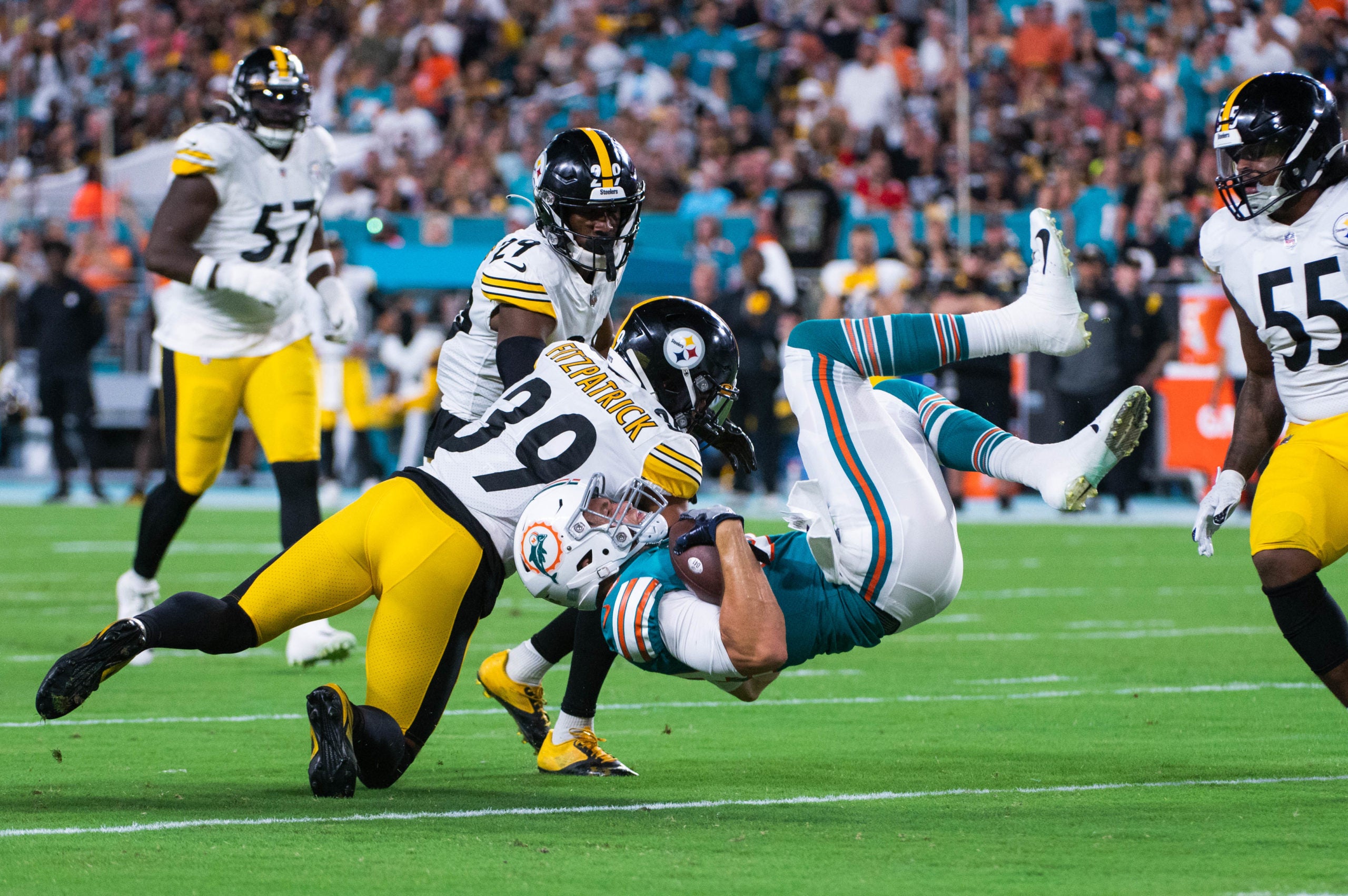 Miami Dolphins tight end Mike Gesicki (88) is upended by Pittsburgh Steelers safety Minkah Fitzpatrick (39) during the first half of the game between the visiting Pittsburgh Steelers and host Miami Dolphins at Hard Rock Stadium on Sunday, October 23, 2022, in Miami Gardens, FL. Final score, Dolphins 16, Steelers, 10. Week 7 Dolphins Vs Pittsburgh Steelers Al 857