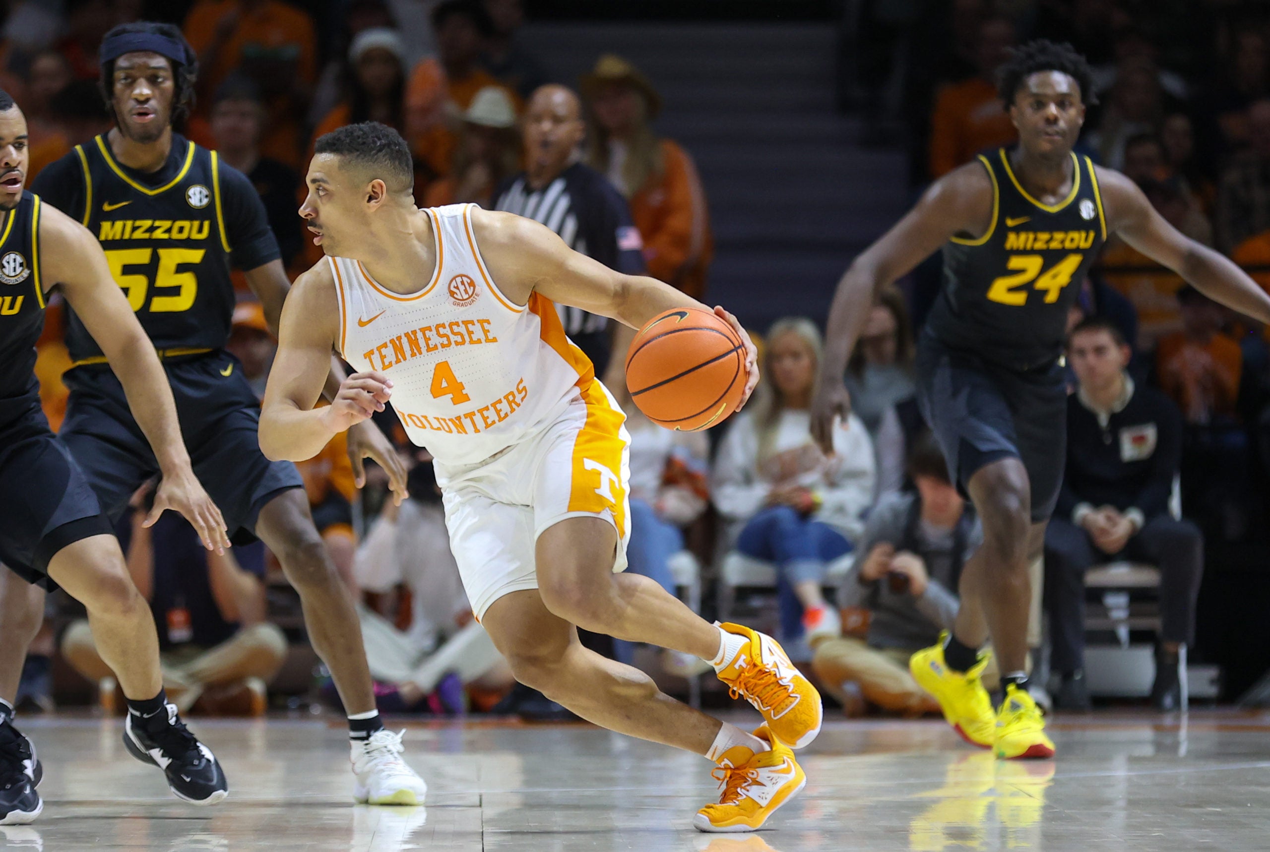 Feb 11, 2023; Knoxville, Tennessee, USA; Tennessee Volunteers guard Tyreke Key (4) moves the ball against Missouri Tigers guard Nick Honor (10) during the second half at Thompson-Boling Arena. Mandatory Credit: Randy Sartin-USA TODAY Sports