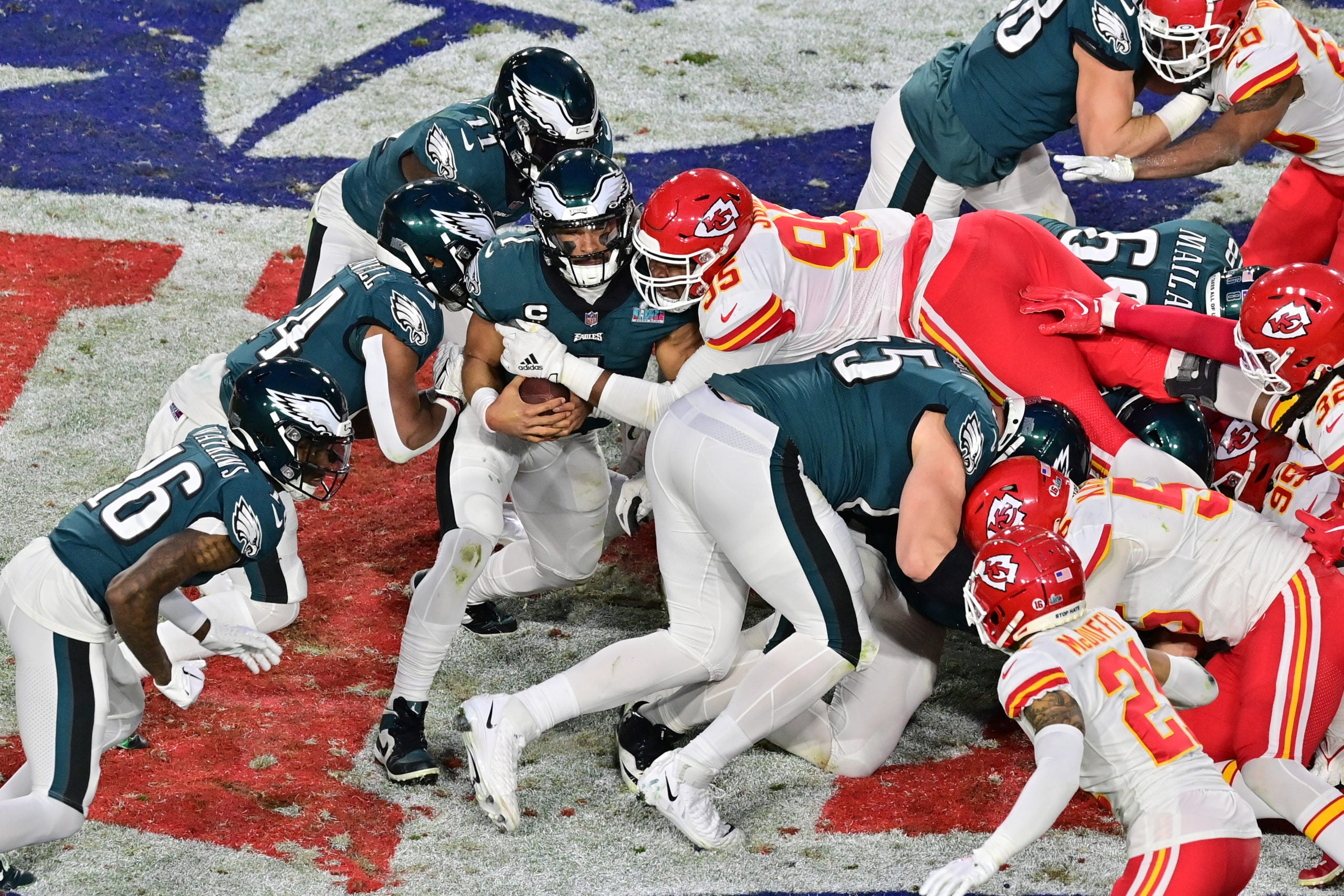 Feb 12, 2023; Glendale, Arizona, US; Kansas City Chiefs defensive tackle Chris Jones (95) tackles Philadelphia Eagles quarterback Jalen Hurts (1) on a quarterback sneak during the second quarter of Super Bowl LVII at State Farm Stadium. Mandatory Credit: Matt Kartozian-USA TODAY Sports
