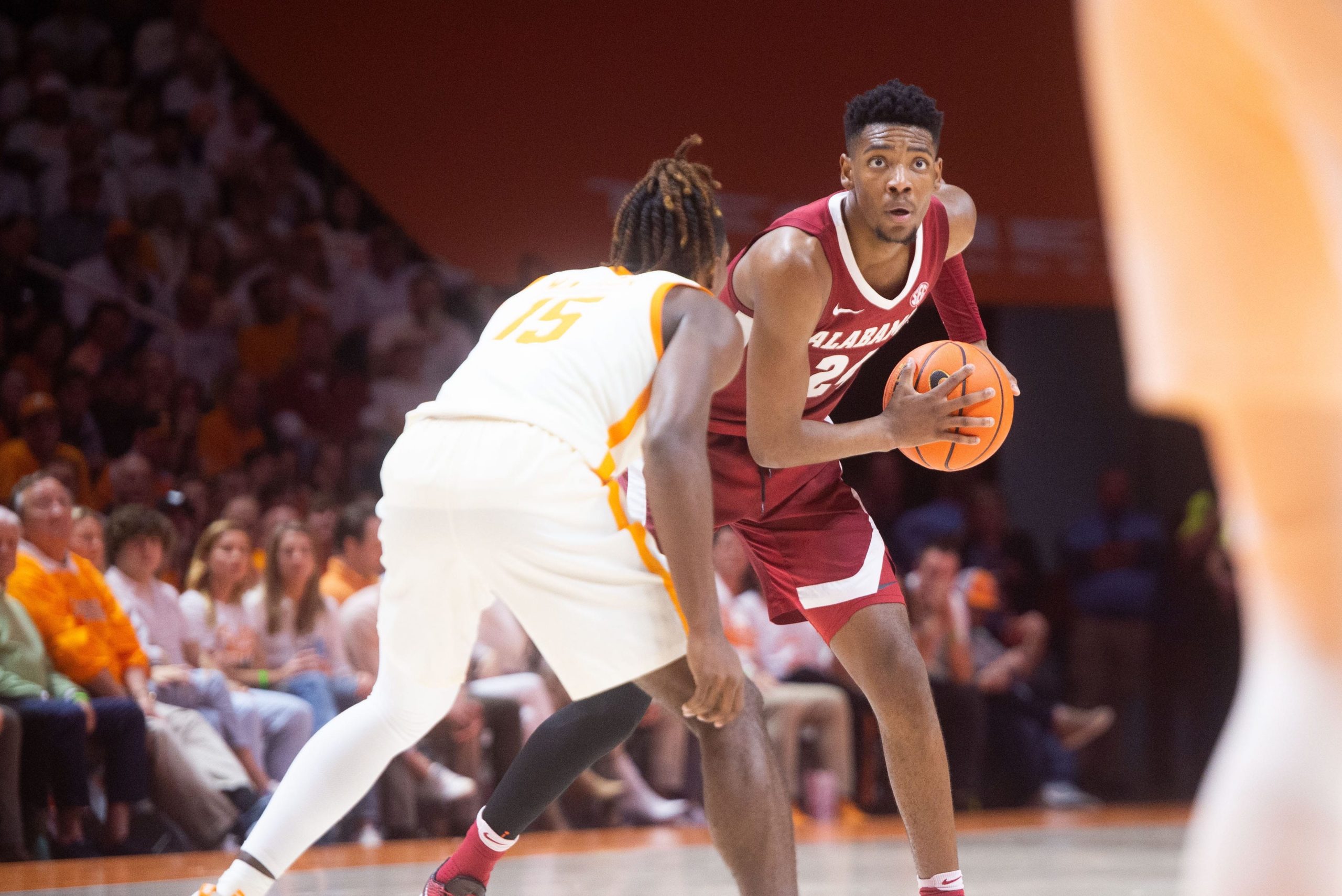 Alabama forward Brandon Miller (24) is defended by Tennessee guard Jahmai Mashack (15) during a basketball game between the Tennessee Volunteers and the Alabama Crimson Tide held at Thompson-Boling Arena in Knoxville, Tenn., on Wednesday, Feb. 15, 2023. Kns Vols Bama Hoops