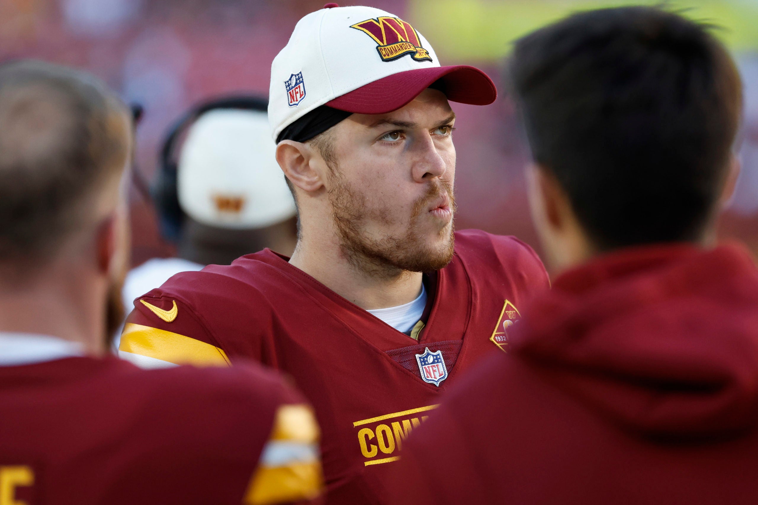 Landover, Maryland, USA; Washington Commanders quarterback Taylor Heinicke (4) stands on the sidelines against the Cleveland Browns during the fourth quarter at FedExField.