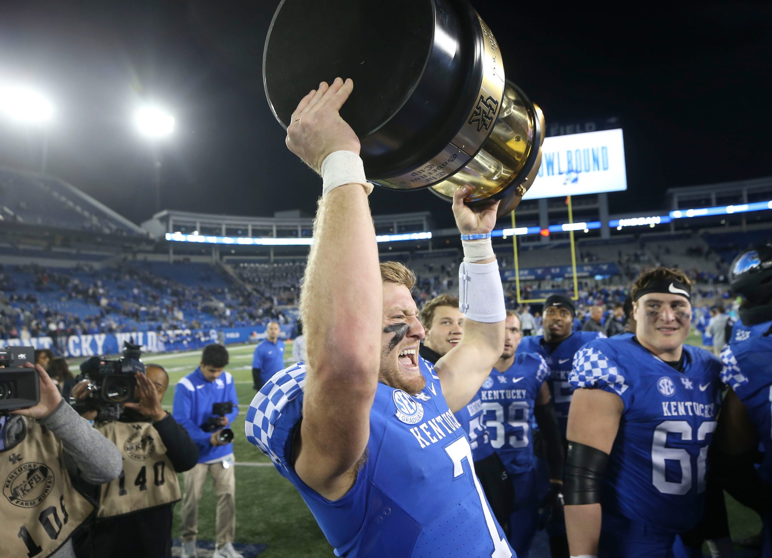 Kentucky quarterback Will Levis celebrates with the Governors Cup trophy after the Wildcats beat visiting Louisville in Saturday's Battle of the Bluegrass college football game. Nov. 26, 2022. Louisville Vs Kentucky 2022 Football
