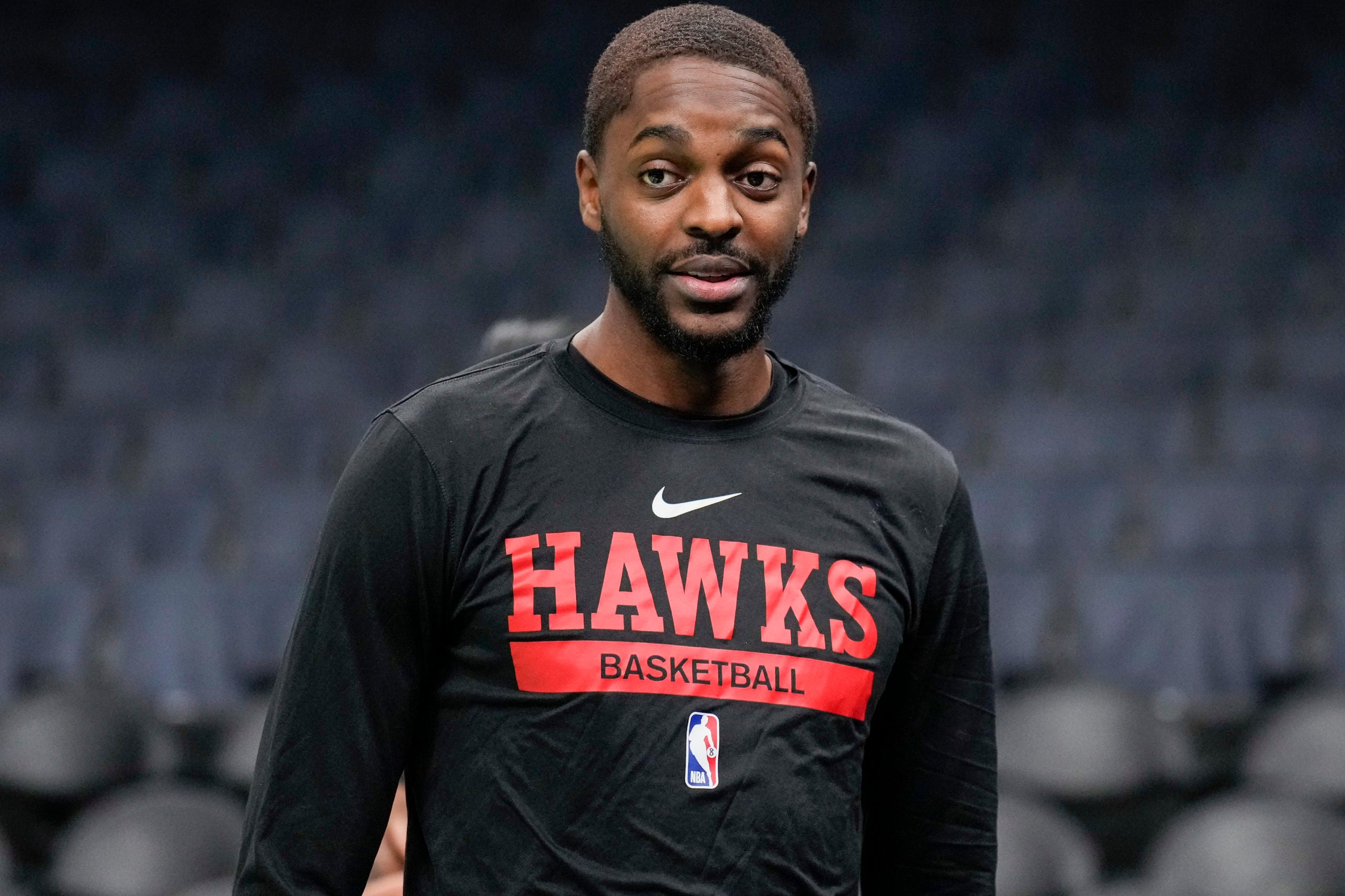 Charlotte, North Carolina, USA; Atlanta Hawks forward Justin Holiday (8) during pre game warm ups against the Charlotte Hornets at Spectrum Center.