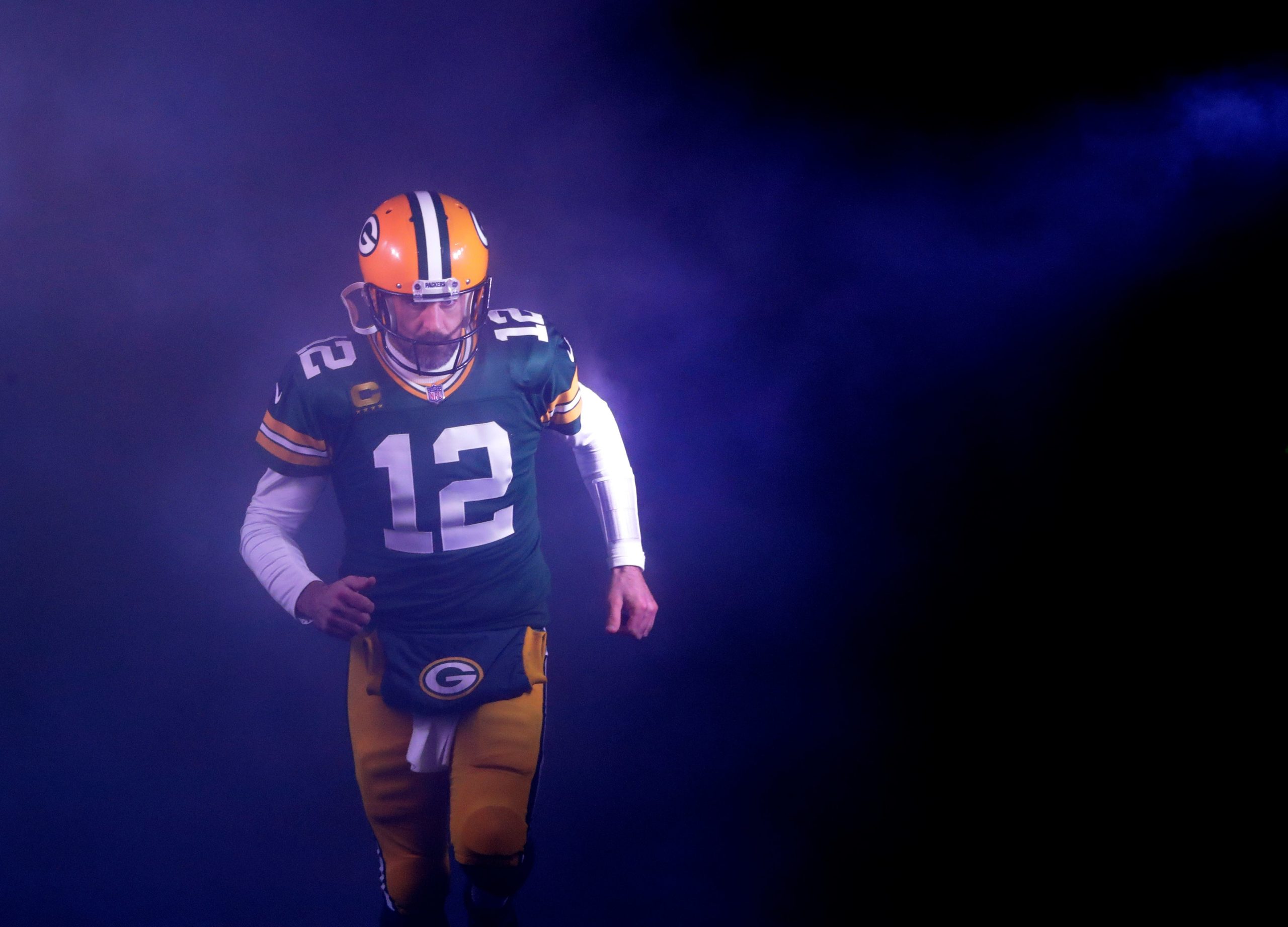 Green Bay Packers quarterback Aaron Rodgers (12) runs out on to the field as he is announced against the Detroit Lions during their football game Sunday, January 8, 2023, at Lambeau Field in Green Bay, Wis.