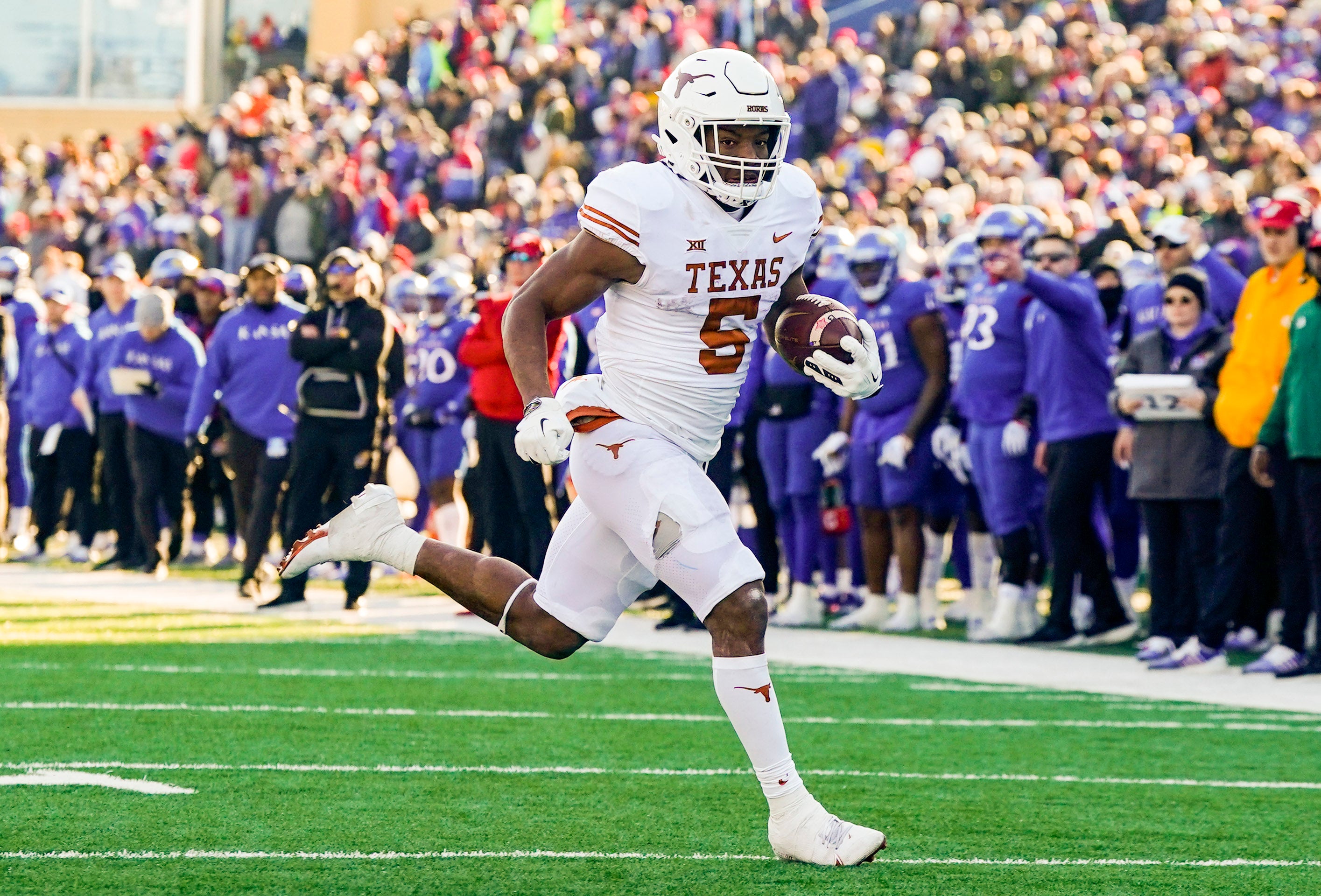 Nov 19, 2022; Lawrence, Kansas, USA; Texas Longhorns running back Bijan Robinson (5) runs for a touchdown during the first half against the Kansas Jayhawks at David Booth Kansas Memorial Stadium. Mandatory Credit: Jay Biggerstaff-USA TODAY Sports