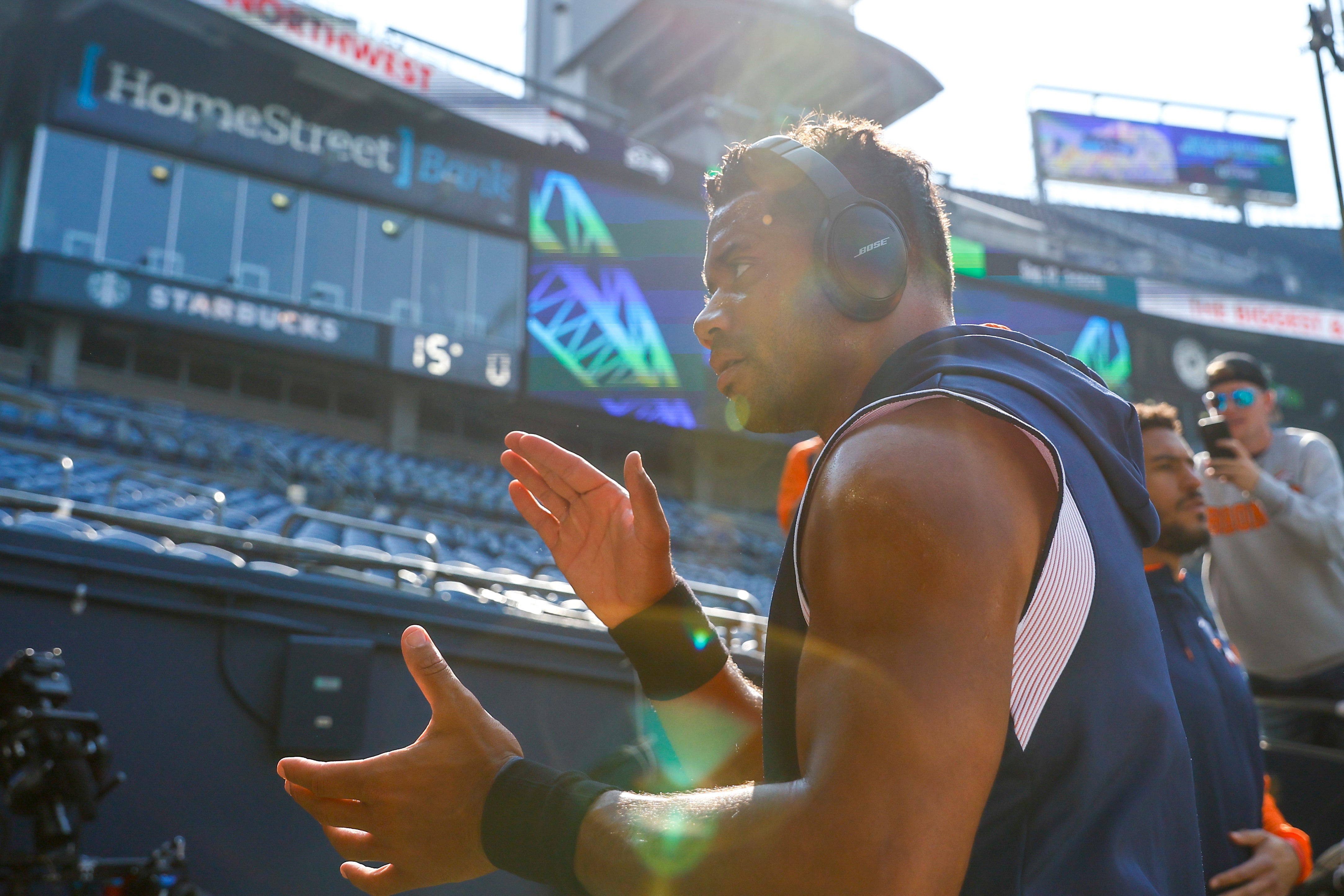 Seattle, Washington, USA; Denver Broncos quarterback Russell Wilson (3) claps as he returns to the locker room following pregame warmups against the Seattle Seahawks at Lumen Field.